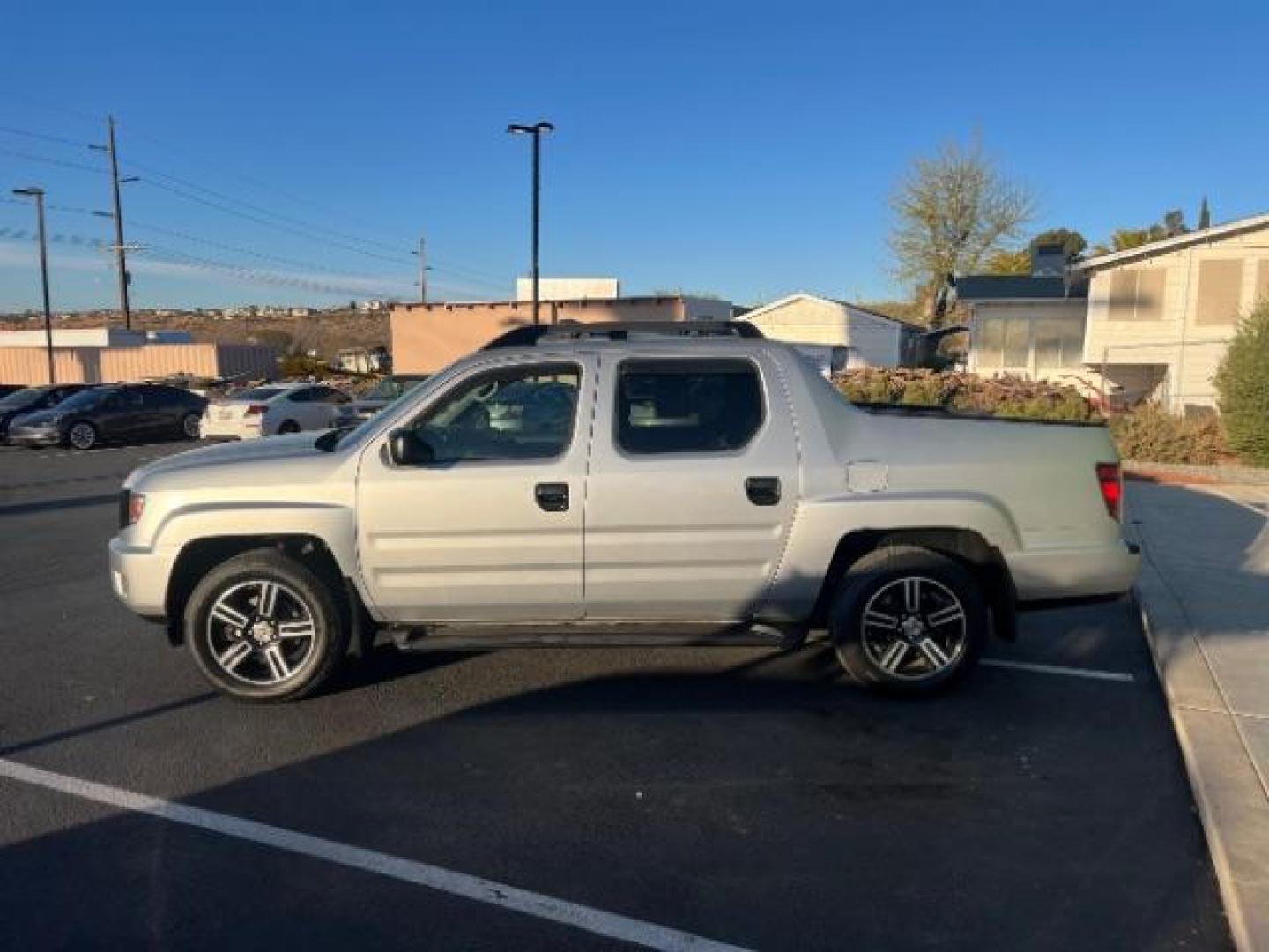 2013 Alabaster Silver Metallic /Black Honda Ridgeline Sport (5FPYK1F75DB) with an 3.5L V-6 variable valve control engine, Continuously Variable Transmission transmission, located at 940 North Main Street, Cedar City, UT, 84720, (435) 628-0023, 37.692936, -113.061897 - We specialize in helping ALL people get the best financing available. No matter your credit score, good, bad or none we can get you an amazing rate. Had a bankruptcy, divorce, or repossessions? We give you the green light to get your credit back on the road. Low down and affordable payments that fit - Photo#3