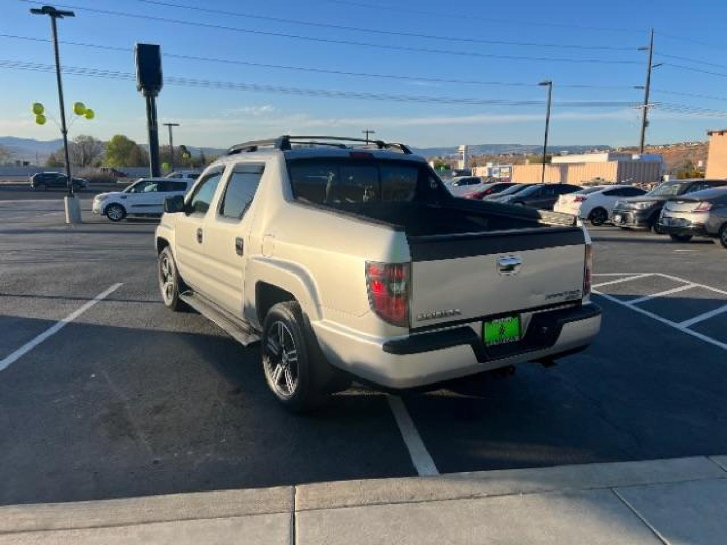 2013 Alabaster Silver Metallic /Black Honda Ridgeline Sport (5FPYK1F75DB) with an 3.5L V-6 variable valve control engine, Continuously Variable Transmission transmission, located at 940 North Main Street, Cedar City, UT, 84720, (435) 628-0023, 37.692936, -113.061897 - We specialize in helping ALL people get the best financing available. No matter your credit score, good, bad or none we can get you an amazing rate. Had a bankruptcy, divorce, or repossessions? We give you the green light to get your credit back on the road. Low down and affordable payments that fit - Photo#4