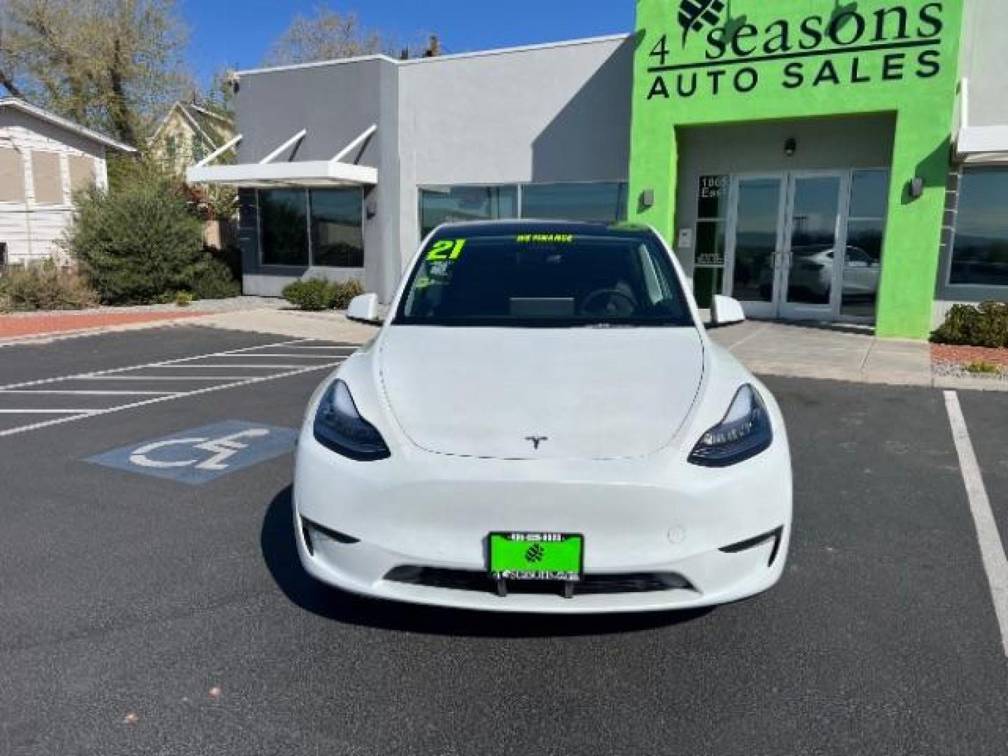2021 Pearl White Multi-Coat /Black Tesla Model Y Long Range Dual Motor All-Wheel Drive (5YJYGDEE9MF) with an 1.4L L4 DOHC 16V PLUG-IN HYBRID engine, Continuously Variable Transmission transmission, located at 1865 East Red Hills Pkwy, St. George, 84770, (435) 628-0023, 37.120850, -113.543640 - ***PRICE INCLUDES $4k EV REBATE*** Check with IRS website to be sure you qualify for the credit. Excellent condition, LONG RANGE AWD Full motor and battery warranty up to 120k miles. Financing for ALL credit types. Call our stop by. 4 Seasons Auto Southern Utah EV experts! - Photo#3