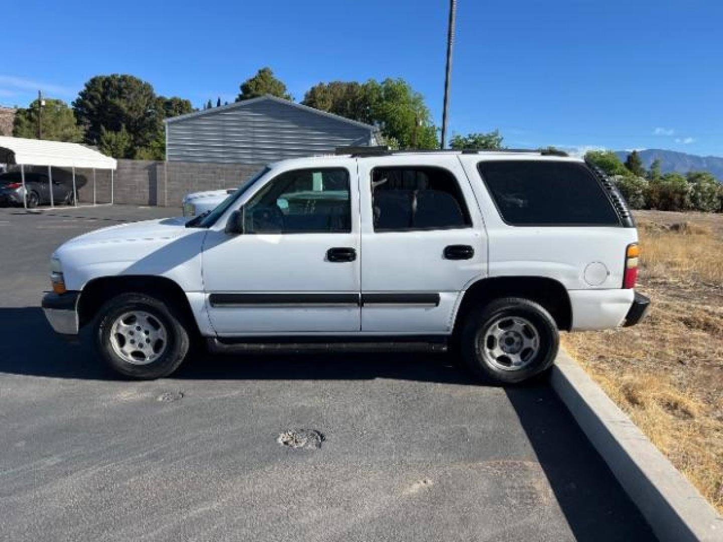 2004 Summit White /Tan/Neutral Chevrolet Tahoe LS (1GNEC13V44R) with an Vortec 4.8L V-8 regular unleaded engine, Automatic transmission, located at 1865 East Red Hills Pkwy, St. George, 84770, (435) 628-0023, 37.120850, -113.543640 - This vehicle is a Mechanic Special. This means it will need some love. Runs a drives fine but has body damage, leaks or other mechanical issues. It did NOT pass our 50 point inspection. Get a great deal on a less than perfect car. These cars do NOT qualify for our in house financing. Cash and carry, - Photo#3