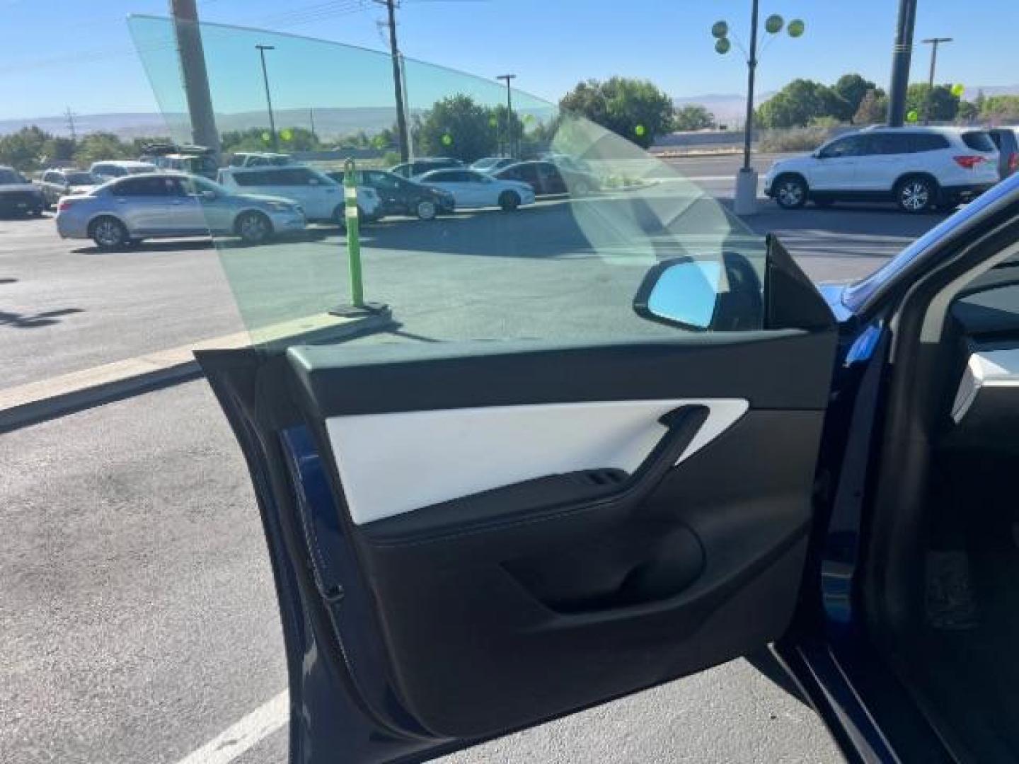 2021 Deep Blue Metallic /Black Tesla Model Y Long Range Dual Motor All-Wheel Drive (5YJYGDEE2MF) with an Electric engine, AUTOMATIC transmission, located at 1865 East Red Hills Pkwy, St. George, 84770, (435) 628-0023, 37.120850, -113.543640 - Excellent Model Y in rare color combo blue on white. Gets 260 miles on full charge. Full battery and motor warranty up to 120k miles Financing for ALL credit types. Aftermarket battery warranty available. We are THE southern Utah Tesla Experts. Call or text for more info - Photo#14