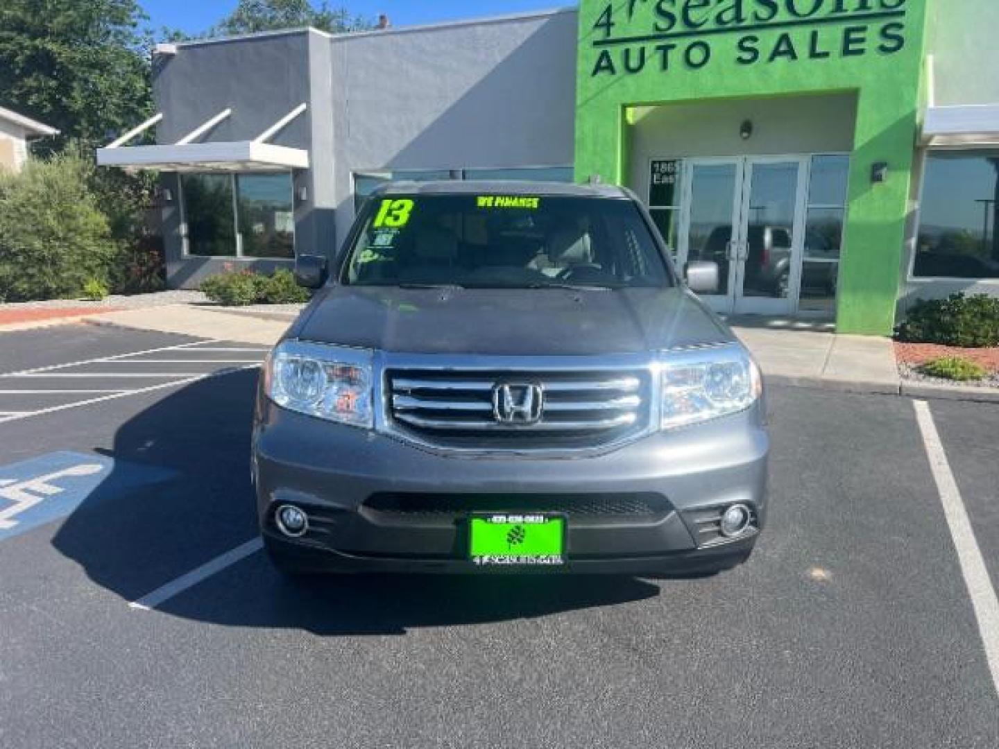 2013 Polished Metal Metallic /Beige Honda Pilot EX-L (5FNYF3H55DB) with an 3.5L V-6 i-VTEC VCM variable valve control engine, Automatic transmission, located at 1865 East Red Hills Pkwy, St. George, 84770, (435) 628-0023, 37.120850, -113.543640 - We specialize in helping ALL people get the best financing available. No matter your credit score, good, bad or none we can get you an amazing rate. Had a bankruptcy, divorce, or repossessions? We give you the green light to get your credit back on the road. Low down and affordable payments that fit - Photo#1