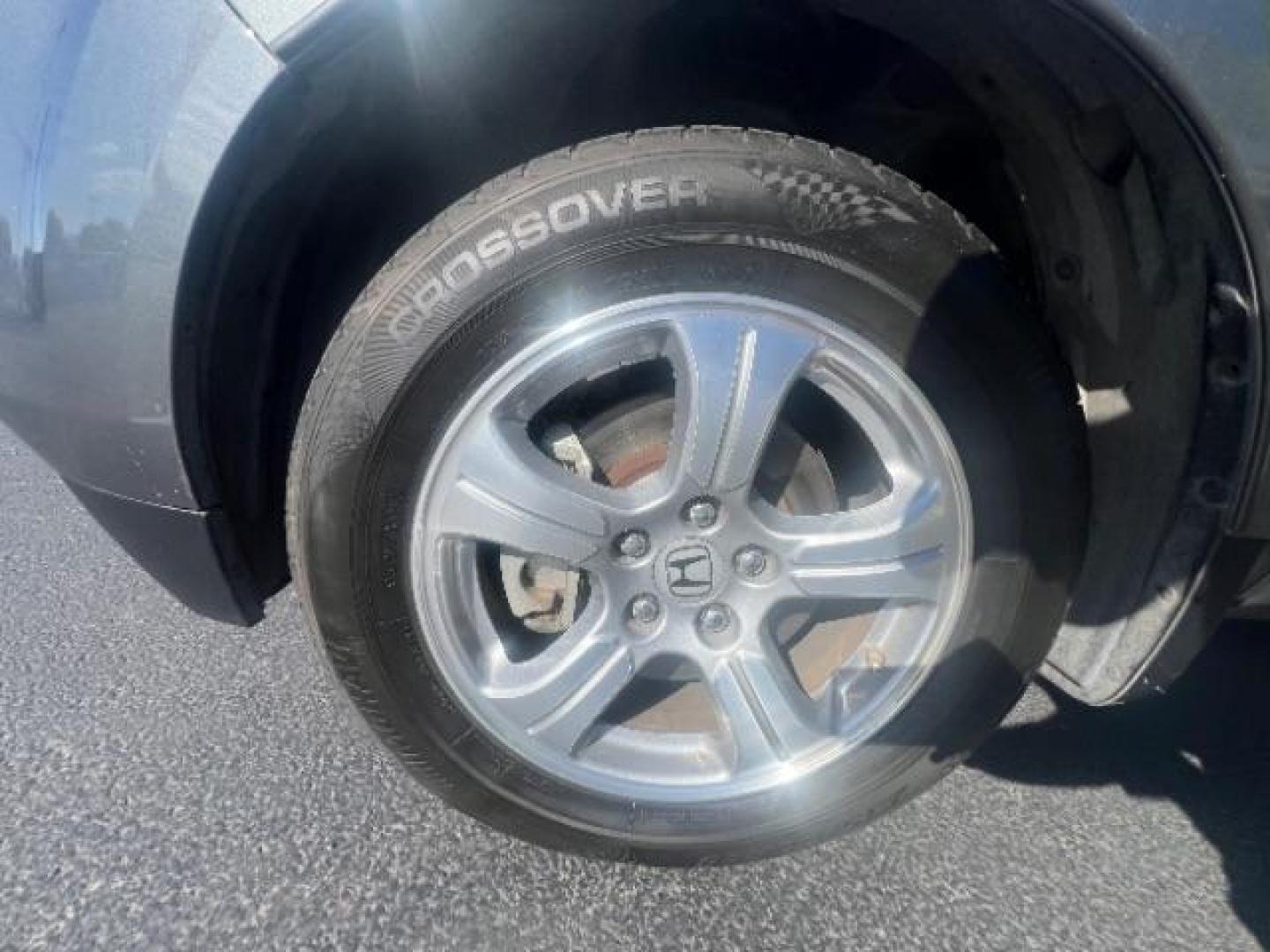 2013 Polished Metal Metallic /Beige Honda Pilot EX-L (5FNYF3H55DB) with an 3.5L V-6 i-VTEC VCM variable valve control engine, Automatic transmission, located at 1865 East Red Hills Pkwy, St. George, 84770, (435) 628-0023, 37.120850, -113.543640 - We specialize in helping ALL people get the best financing available. No matter your credit score, good, bad or none we can get you an amazing rate. Had a bankruptcy, divorce, or repossessions? We give you the green light to get your credit back on the road. Low down and affordable payments that fit - Photo#9