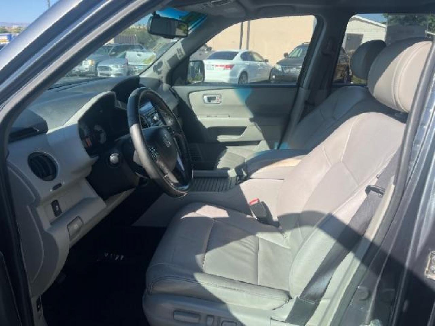 2013 Polished Metal Metallic /Beige Honda Pilot EX-L (5FNYF3H55DB) with an 3.5L V-6 i-VTEC VCM variable valve control engine, Automatic transmission, located at 1865 East Red Hills Pkwy, St. George, 84770, (435) 628-0023, 37.120850, -113.543640 - We specialize in helping ALL people get the best financing available. No matter your credit score, good, bad or none we can get you an amazing rate. Had a bankruptcy, divorce, or repossessions? We give you the green light to get your credit back on the road. Low down and affordable payments that fit - Photo#14