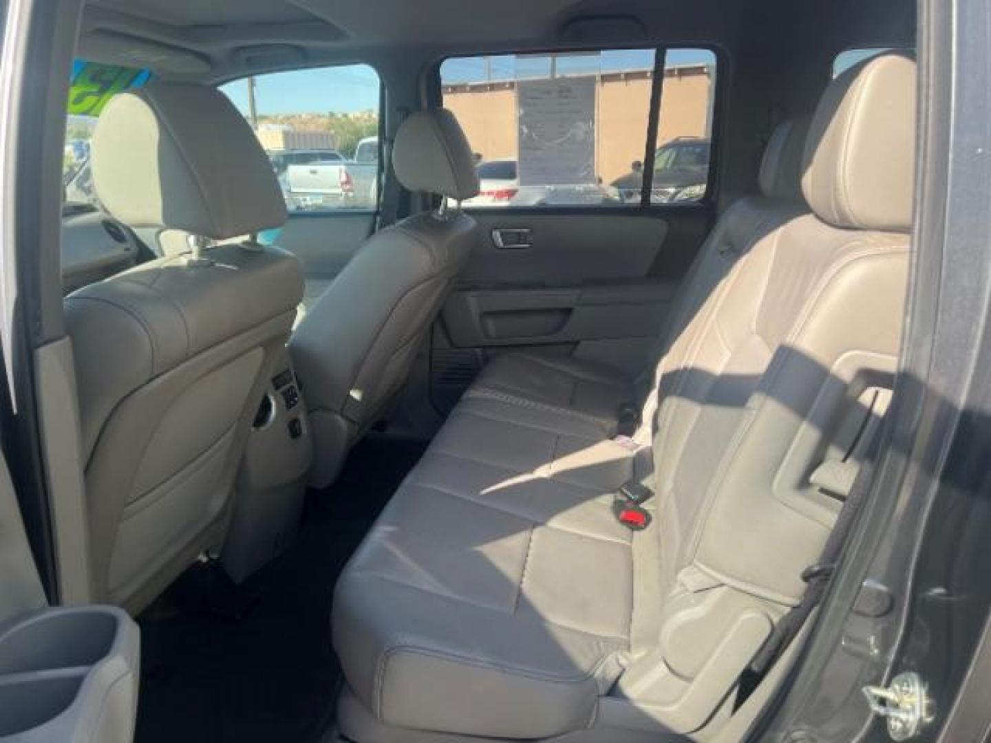 2013 Polished Metal Metallic /Beige Honda Pilot EX-L (5FNYF3H55DB) with an 3.5L V-6 i-VTEC VCM variable valve control engine, Automatic transmission, located at 1865 East Red Hills Pkwy, St. George, 84770, (435) 628-0023, 37.120850, -113.543640 - We specialize in helping ALL people get the best financing available. No matter your credit score, good, bad or none we can get you an amazing rate. Had a bankruptcy, divorce, or repossessions? We give you the green light to get your credit back on the road. Low down and affordable payments that fit - Photo#22