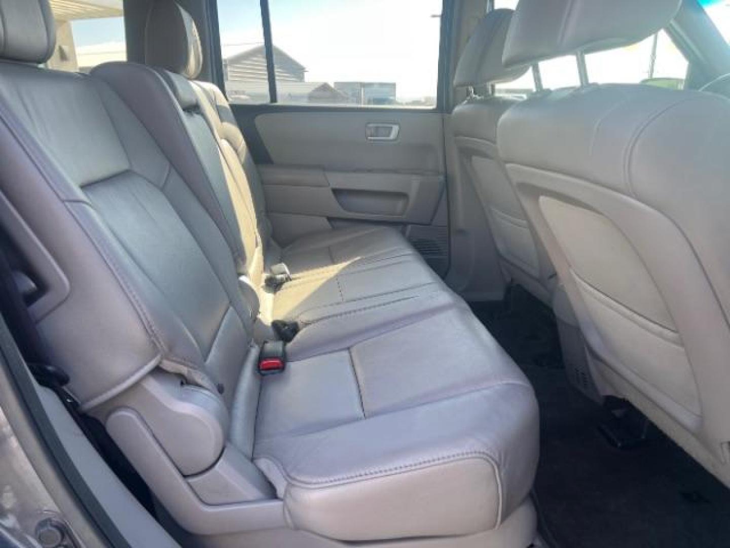 2013 Polished Metal Metallic /Beige Honda Pilot EX-L (5FNYF3H55DB) with an 3.5L V-6 i-VTEC VCM variable valve control engine, Automatic transmission, located at 1865 East Red Hills Pkwy, St. George, 84770, (435) 628-0023, 37.120850, -113.543640 - We specialize in helping ALL people get the best financing available. No matter your credit score, good, bad or none we can get you an amazing rate. Had a bankruptcy, divorce, or repossessions? We give you the green light to get your credit back on the road. Low down and affordable payments that fit - Photo#31