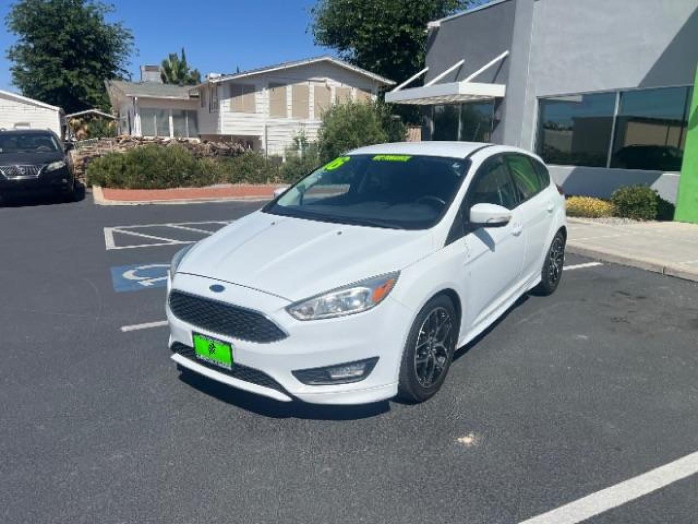 2016 Oxford White /Charcoal Black Ford Focus SE (1FADP3K29GL) with an 2L I-4 gasoline direct injection engine, Automatic transmission, located at 940 North Main Street, Cedar City, UT, 84720, (435) 628-0023, 37.692936, -113.061897 - Photo#2