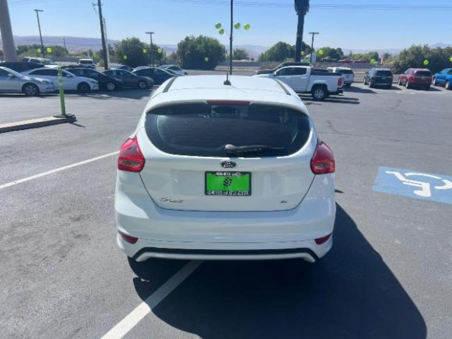 2016 Oxford White /Charcoal Black Ford Focus SE (1FADP3K29GL) with an 2L I-4 gasoline direct injection engine, Automatic transmission, located at 940 North Main Street, Cedar City, UT, 84720, (435) 628-0023, 37.692936, -113.061897 - Photo#5
