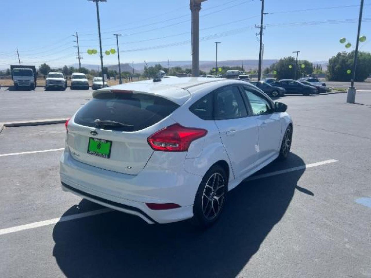 2016 Oxford White /Charcoal Black Ford Focus SE (1FADP3K29GL) with an 2L I-4 gasoline direct injection engine, Automatic transmission, located at 940 North Main Street, Cedar City, UT, 84720, (435) 628-0023, 37.692936, -113.061897 - Photo#6