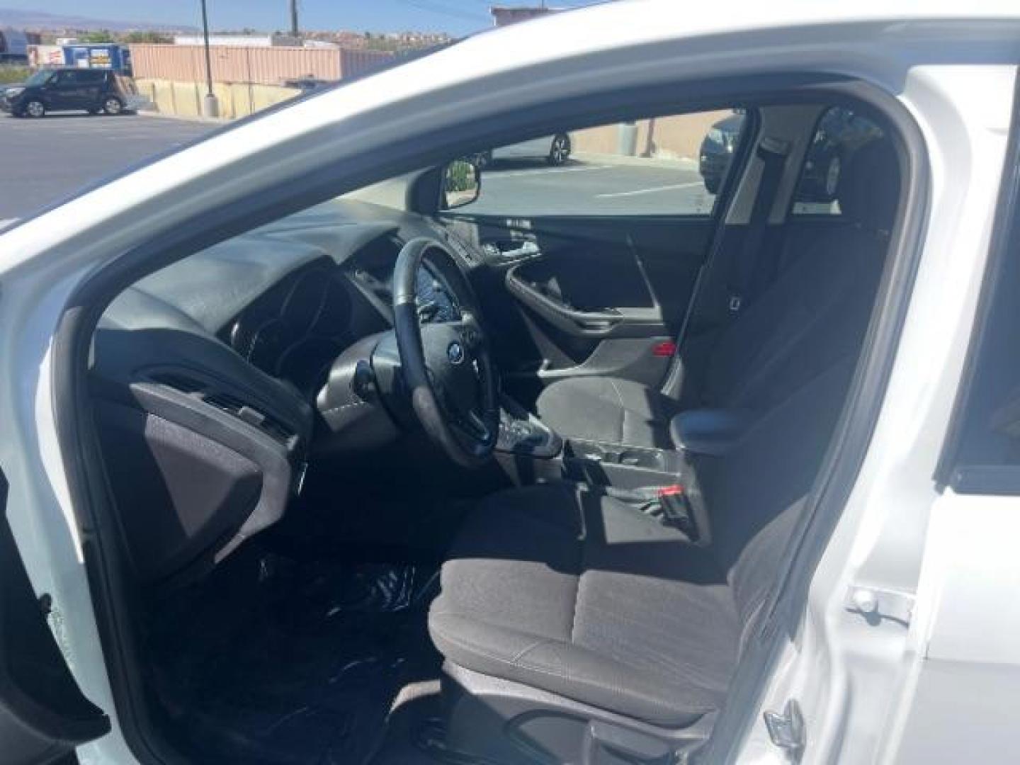 2016 Oxford White /Charcoal Black Ford Focus SE (1FADP3K29GL) with an 2L I-4 gasoline direct injection engine, Automatic transmission, located at 940 North Main Street, Cedar City, UT, 84720, (435) 628-0023, 37.692936, -113.061897 - Photo#14