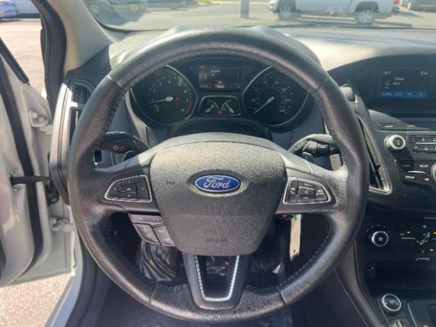 2016 Oxford White /Charcoal Black Ford Focus SE (1FADP3K29GL) with an 2L I-4 gasoline direct injection engine, Automatic transmission, located at 940 North Main Street, Cedar City, UT, 84720, (435) 628-0023, 37.692936, -113.061897 - Photo#16