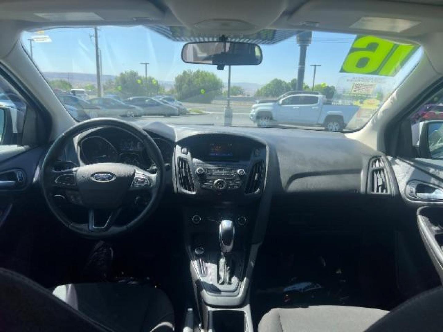 2016 Oxford White /Charcoal Black Ford Focus SE (1FADP3K29GL) with an 2L I-4 gasoline direct injection engine, Automatic transmission, located at 940 North Main Street, Cedar City, UT, 84720, (435) 628-0023, 37.692936, -113.061897 - Photo#23