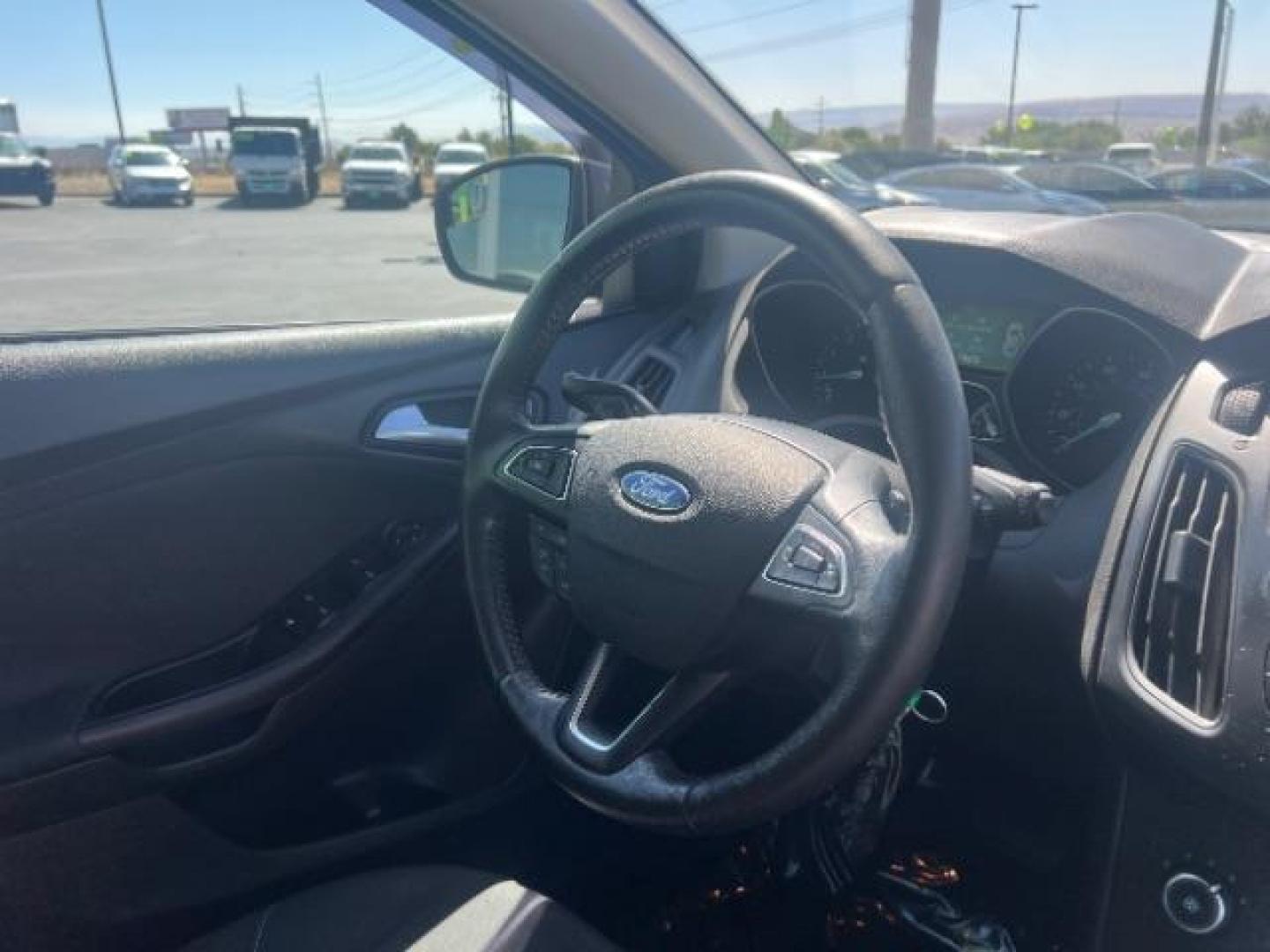 2016 Oxford White /Charcoal Black Ford Focus SE (1FADP3K29GL) with an 2L I-4 gasoline direct injection engine, Automatic transmission, located at 940 North Main Street, Cedar City, UT, 84720, (435) 628-0023, 37.692936, -113.061897 - Photo#30