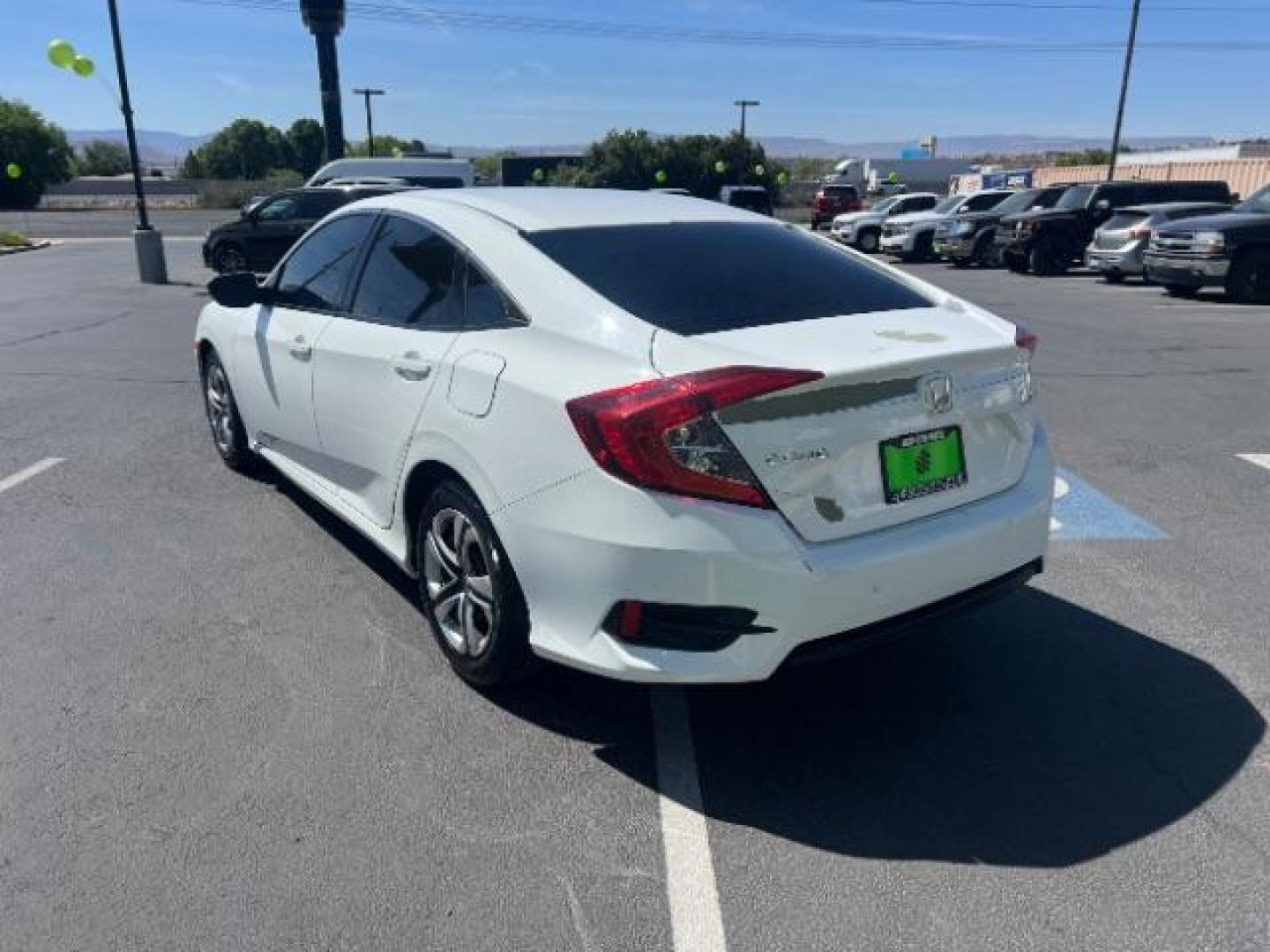 2016 Taffeta White /Ivory Honda Civic LX (2HGFC2F52GH) with an 2L I-4 DOHC engine, Automatic transmission, located at 1865 East Red Hills Pkwy, St. George, 84770, (435) 628-0023, 37.120850, -113.543640 - We specialize in helping ALL people get the best financing available. No matter your credit score, good, bad or none we can get you an amazing rate. Had a bankruptcy, divorce, or repossessions? We give you the green light to get your credit back on the road. Low down and affordable payments that fit- Photo#4