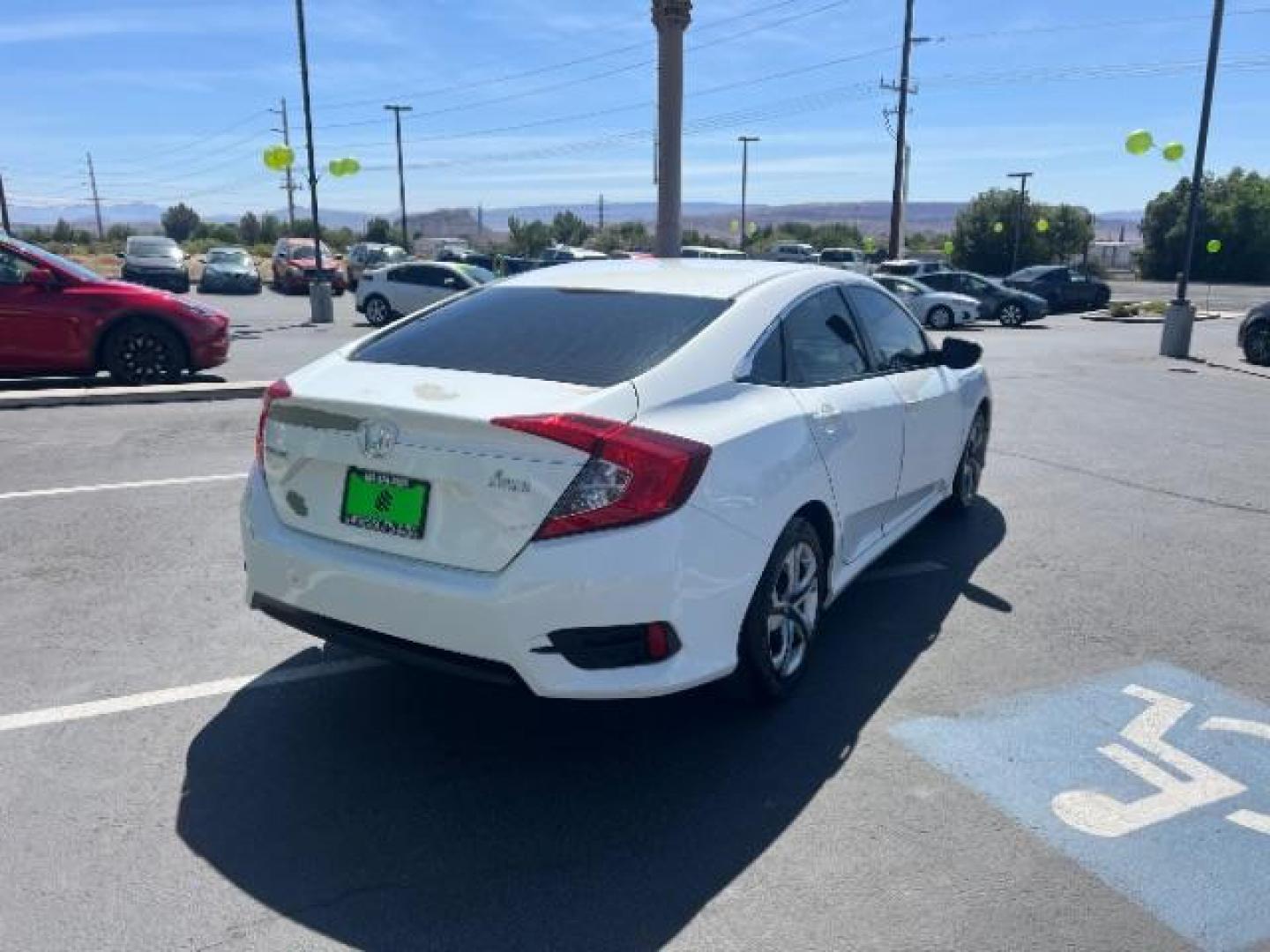 2016 Taffeta White /Ivory Honda Civic LX (2HGFC2F52GH) with an 2L I-4 DOHC engine, Automatic transmission, located at 1865 East Red Hills Pkwy, St. George, 84770, (435) 628-0023, 37.120850, -113.543640 - We specialize in helping ALL people get the best financing available. No matter your credit score, good, bad or none we can get you an amazing rate. Had a bankruptcy, divorce, or repossessions? We give you the green light to get your credit back on the road. Low down and affordable payments that fit- Photo#6