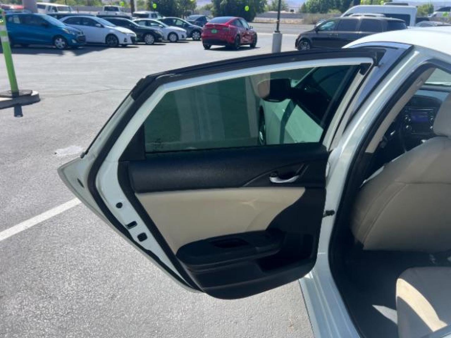 2016 Taffeta White /Ivory Honda Civic LX (2HGFC2F52GH) with an 2L I-4 DOHC engine, Automatic transmission, located at 1865 East Red Hills Pkwy, St. George, 84770, (435) 628-0023, 37.120850, -113.543640 - We specialize in helping ALL people get the best financing available. No matter your credit score, good, bad or none we can get you an amazing rate. Had a bankruptcy, divorce, or repossessions? We give you the green light to get your credit back on the road. Low down and affordable payments that fit- Photo#19