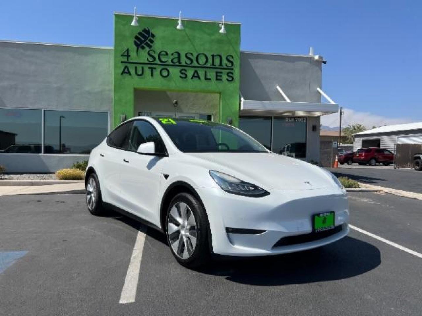 2021 Pearl White Multi-Coat Tesla Model Y Long Range Dual Motor All-Wheel Drive (5YJYGAEE9MF) , located at 1865 East Red Hills Pkwy, St. George, 84770, (435) 628-0023, 37.120850, -113.543640 - This Tesla is an AWD Long Range. 3rd ROW! 7 Seats!. Battery is 95% healthy, 293 on full charge. Near new condition! Full Tesla factory warranty up to 120k miles. Extended EV battery warranty available. Financing for ALL credit types. 4 Seasons Auto THE southern Utah Tesla Experts. Call or text - Photo#0