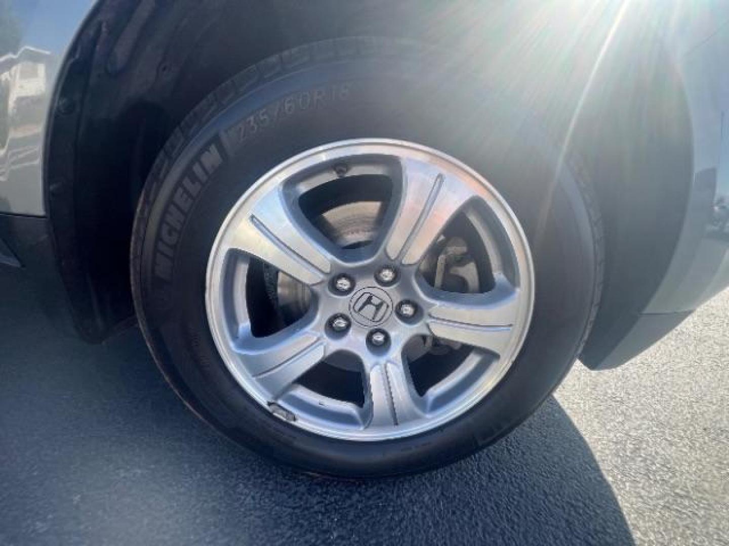 2013 Polished Metal Metallic /Gray Honda Pilot EX (5FNYF3H47DB) with an 3.5L V-6 i-VTEC VCM variable valve control engine, Automatic transmission, located at 1865 East Red Hills Pkwy, St. George, 84770, (435) 628-0023, 37.120850, -113.543640 - Photo#9