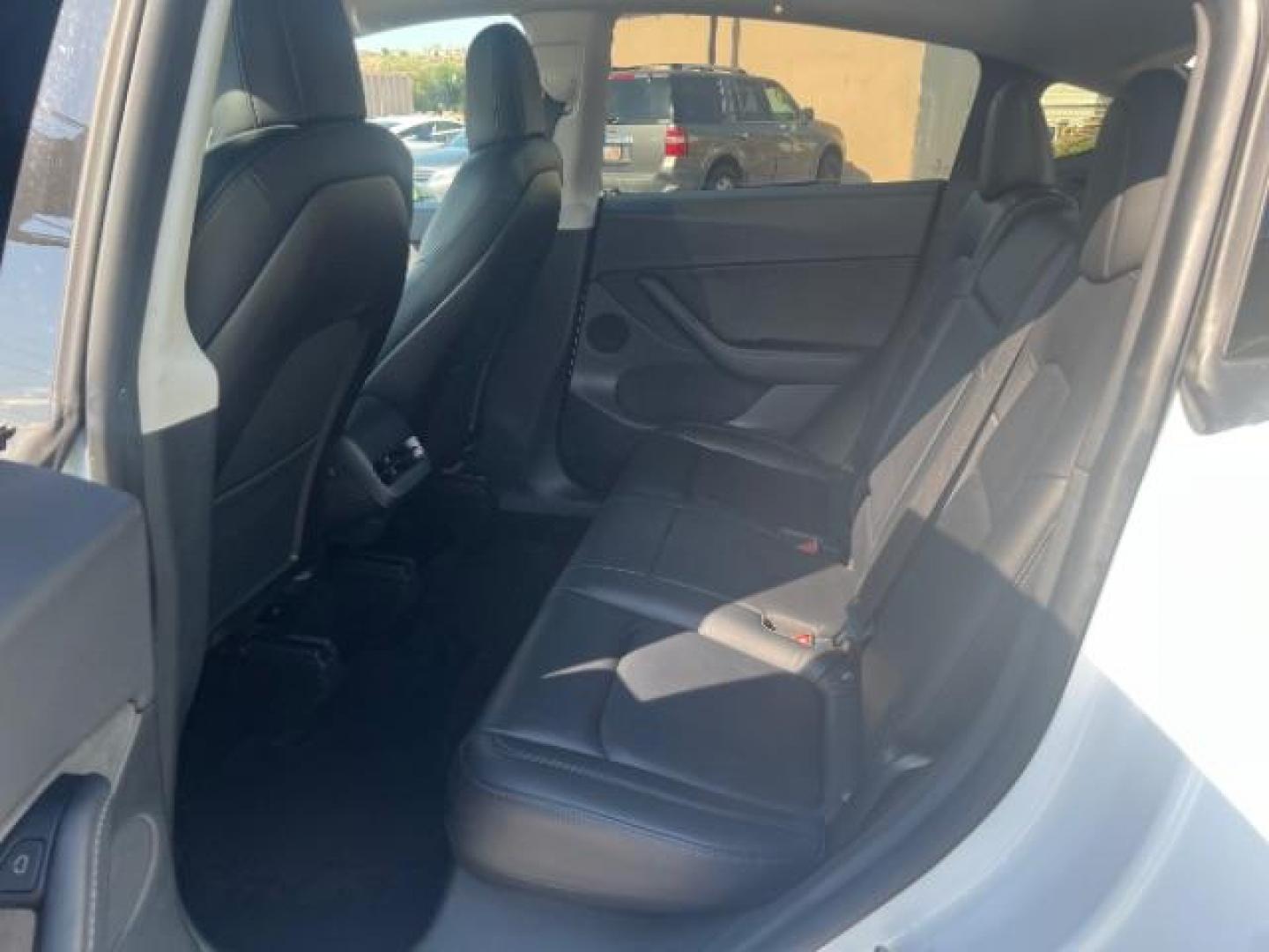 2020 Pearl White Multi-Coat /Black Tesla Model Y Long Range Dual Motor All-Wheel Drive (5YJYGDEE6LF) with an ELECTRIC engine, Continuously Variable Transmission transmission, located at 1865 East Red Hills Pkwy, St. George, 84770, (435) 628-0023, 37.120850, -113.543640 - This Tesla is an AWD Long range. Battery is 90% healthy, 289 on full charge. Near new condition! Full Tesla factory warranty up to 120k miles. Extended EV battery warranty available. Financing for ALL credit types. 4 Seasons Auto THE southern Utah Tesla Experts. Call or text for more info DL# 7 - Photo#21