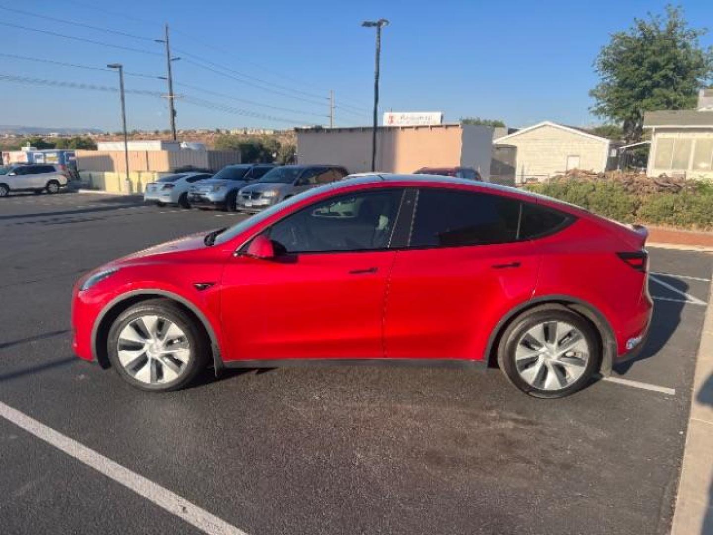 2021 Red Multi-Coat /Black Tesla Model Y Long Range Dual Motor All-Wheel Drive (5YJYGDEE8MF) with an ELECTRIC engine, Continuously Variable Transmission transmission, located at 1865 East Red Hills Pkwy, St. George, 84770, (435) 628-0023, 37.120850, -113.543640 - This Tesla is an AWD Long Range. Battery is 90% healthy, 289 on full charge. Near new condition! Full Tesla factory warranty up to 120k miles. Extended EV battery warranty available. Financing for ALL credit types. 4 Seasons Auto THE southern Utah Tesla Experts. Call or text for more info DL# 7 - Photo#5