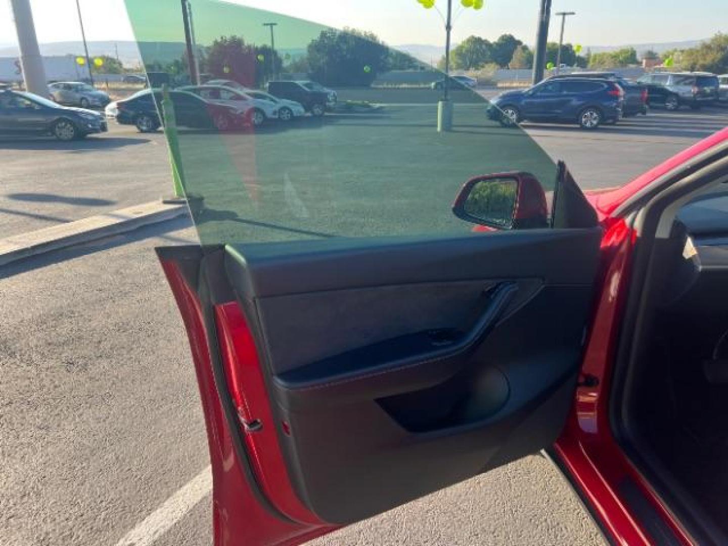 2021 Red Multi-Coat /Black Tesla Model Y Long Range Dual Motor All-Wheel Drive (5YJYGDEE8MF) with an ELECTRIC engine, Continuously Variable Transmission transmission, located at 1865 East Red Hills Pkwy, St. George, 84770, (435) 628-0023, 37.120850, -113.543640 - This Tesla is an AWD Long Range. Battery is 90% healthy, 289 on full charge. Near new condition! Full Tesla factory warranty up to 120k miles. Extended EV battery warranty available. Financing for ALL credit types. 4 Seasons Auto THE southern Utah Tesla Experts. Call or text for more info DL# 7 - Photo#14