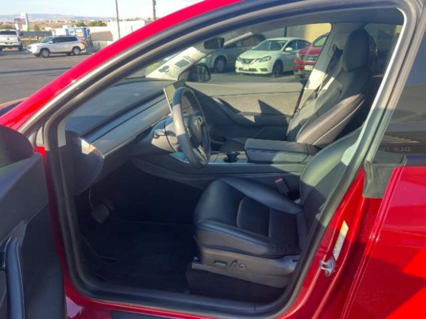 2021 Red Multi-Coat /Black Tesla Model Y Long Range Dual Motor All-Wheel Drive (5YJYGDEE8MF) with an ELECTRIC engine, Continuously Variable Transmission transmission, located at 1865 East Red Hills Pkwy, St. George, 84770, (435) 628-0023, 37.120850, -113.543640 - This Tesla is an AWD Long Range. Battery is 90% healthy, 289 on full charge. Near new condition! Full Tesla factory warranty up to 120k miles. Extended EV battery warranty available. Financing for ALL credit types. 4 Seasons Auto THE southern Utah Tesla Experts. Call or text for more info DL# 7 - Photo#16