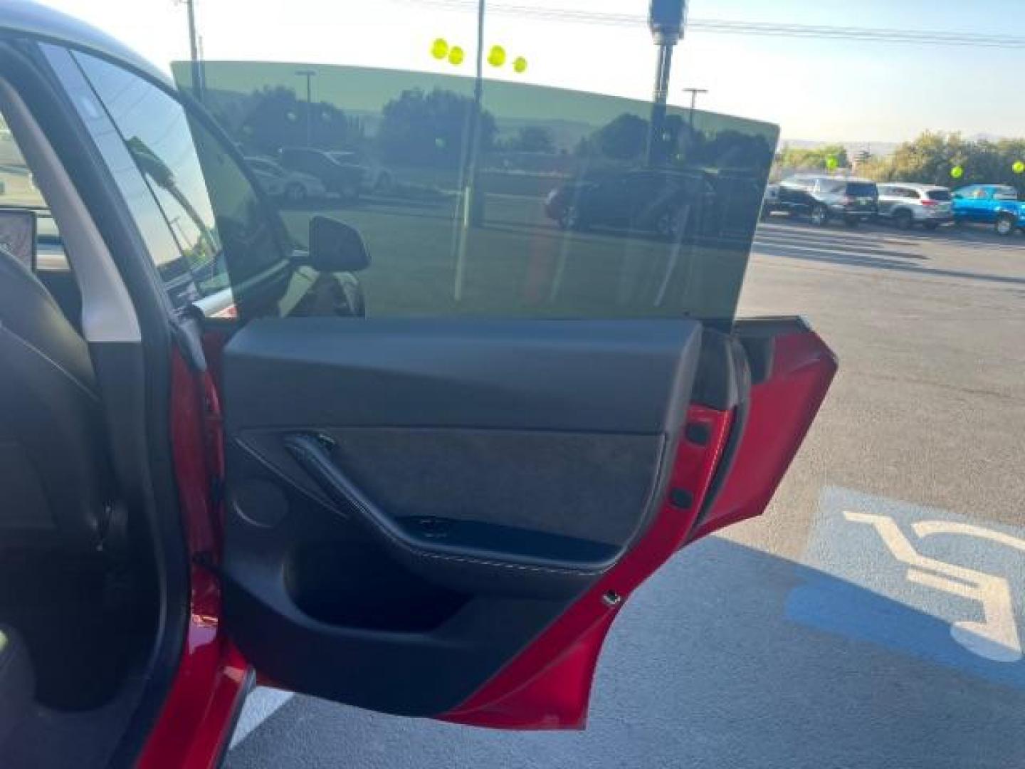 2021 Red Multi-Coat /Black Tesla Model Y Long Range Dual Motor All-Wheel Drive (5YJYGDEE8MF) with an ELECTRIC engine, Continuously Variable Transmission transmission, located at 1865 East Red Hills Pkwy, St. George, 84770, (435) 628-0023, 37.120850, -113.543640 - This Tesla is an AWD Long Range. Battery is 90% healthy, 289 on full charge. Near new condition! Full Tesla factory warranty up to 120k miles. Extended EV battery warranty available. Financing for ALL credit types. 4 Seasons Auto THE southern Utah Tesla Experts. Call or text for more info DL# 7 - Photo#24