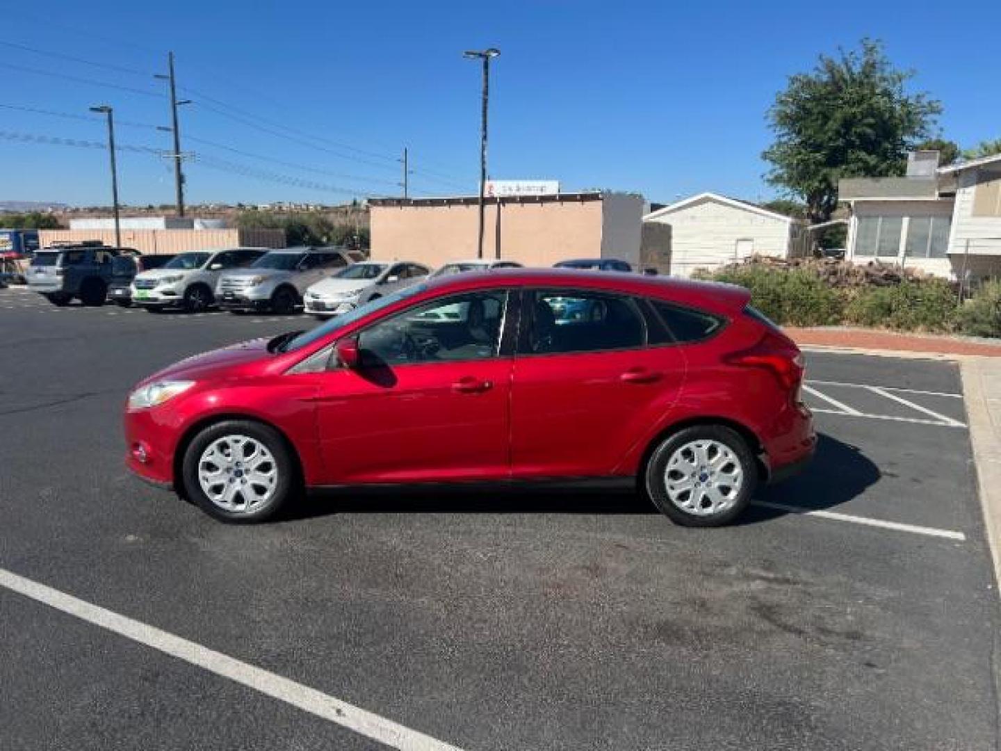 2012 Candy Red Metallic Tinted Clearcoat /Charcoal Black w/Warm Steel Surround Ford Focus SE (1FAHP3K27CL) with an 2L I-4 gasoline direct injection engine, Automatic transmission, located at 1865 East Red Hills Pkwy, St. George, 84770, (435) 628-0023, 37.120850, -113.543640 - We specialize in helping ALL people get the best financing available. No matter your credit score, good, bad or none we can get you an amazing rate. Had a bankruptcy, divorce, or repossessions? We give you the green light to get your credit back on the road. Low down and affordable payments that fit - Photo#3