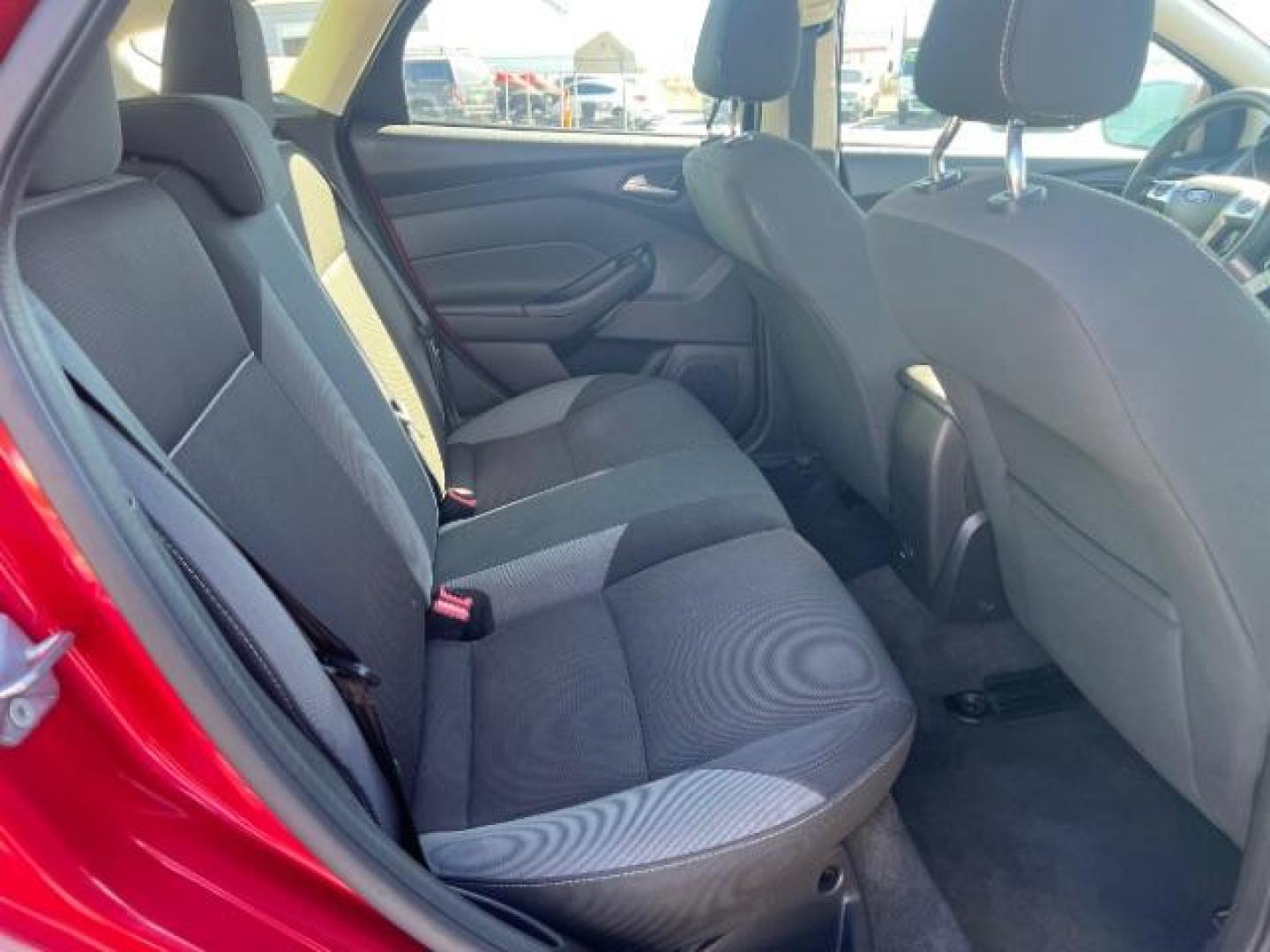 2012 Candy Red Metallic Tinted Clearcoat /Charcoal Black w/Warm Steel Surround Ford Focus SE (1FAHP3K27CL) with an 2L I-4 gasoline direct injection engine, Automatic transmission, located at 1865 East Red Hills Pkwy, St. George, 84770, (435) 628-0023, 37.120850, -113.543640 - We specialize in helping ALL people get the best financing available. No matter your credit score, good, bad or none we can get you an amazing rate. Had a bankruptcy, divorce, or repossessions? We give you the green light to get your credit back on the road. Low down and affordable payments that fit - Photo#26