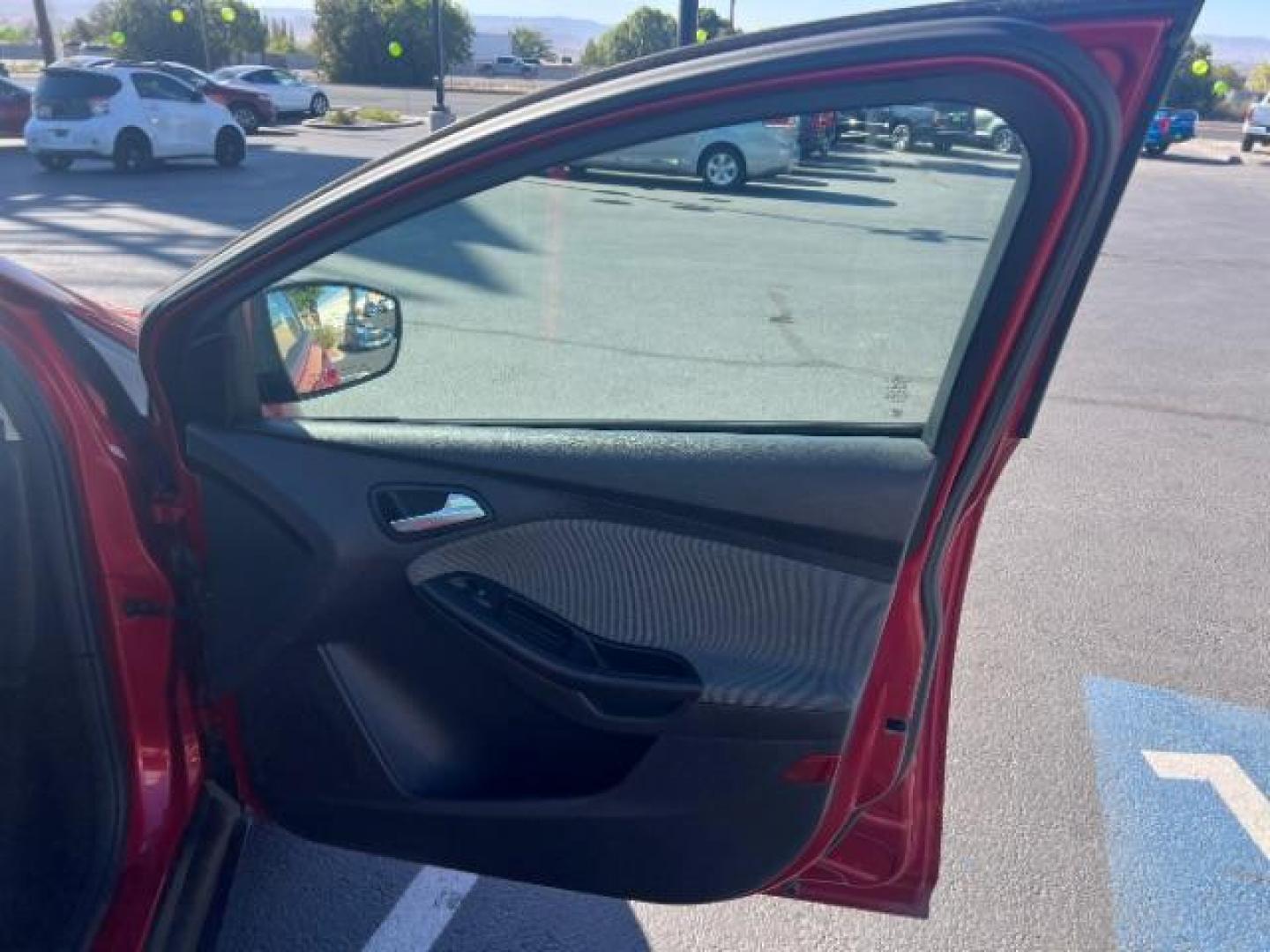2012 Candy Red Metallic Tinted Clearcoat /Charcoal Black w/Warm Steel Surround Ford Focus SE (1FAHP3K27CL) with an 2L I-4 gasoline direct injection engine, Automatic transmission, located at 1865 East Red Hills Pkwy, St. George, 84770, (435) 628-0023, 37.120850, -113.543640 - We specialize in helping ALL people get the best financing available. No matter your credit score, good, bad or none we can get you an amazing rate. Had a bankruptcy, divorce, or repossessions? We give you the green light to get your credit back on the road. Low down and affordable payments that fit - Photo#27