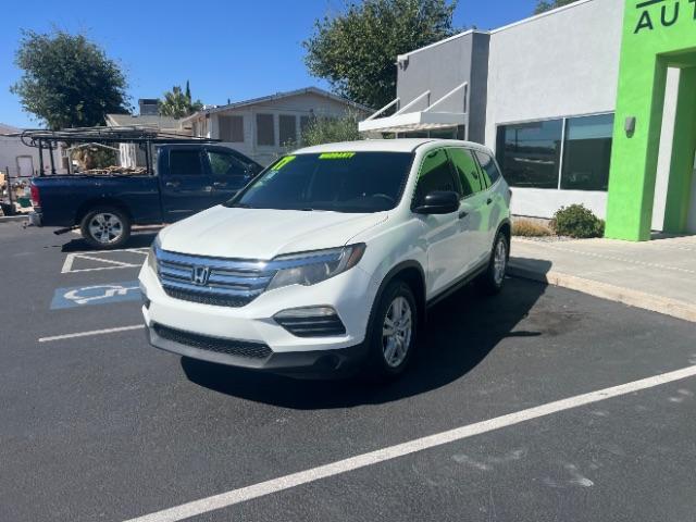 2017 White Diamond Pearl /Black Honda Pilot LX (5FNYF5H14HB) with an 3.5L V-6 gasoline direct injection engine, Automatic transmission, located at 940 North Main Street, Cedar City, UT, 84720, (435) 628-0023, 37.692936, -113.061897 - We specialize in helping ALL people get the best financing available. No matter your credit score, good, bad or none we can get you an amazing rate. Had a bankruptcy, divorce, or repossessions? We give you the green light to get your credit back on the road. Low down and affordable payments that fit - Photo#2
