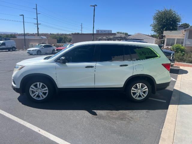 2017 White Diamond Pearl /Black Honda Pilot LX (5FNYF5H14HB) with an 3.5L V-6 gasoline direct injection engine, Automatic transmission, located at 940 North Main Street, Cedar City, UT, 84720, (435) 628-0023, 37.692936, -113.061897 - We specialize in helping ALL people get the best financing available. No matter your credit score, good, bad or none we can get you an amazing rate. Had a bankruptcy, divorce, or repossessions? We give you the green light to get your credit back on the road. Low down and affordable payments that fit - Photo#3