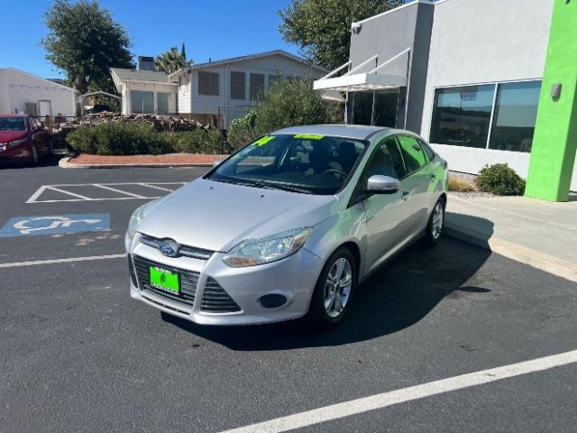 2014 Ingot Silver Metalli /Charcoal Black Ford Focus SE Sedan (1FADP3F21EL) with an 2.0L L4 DOHC 16V engine, 6-Speed Automatic transmission, located at 1865 East Red Hills Pkwy, St. George, 84770, (435) 628-0023, 37.120850, -113.543640- Photo#2