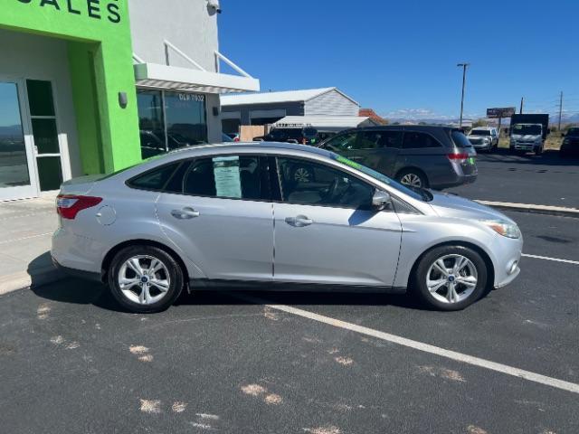 2014 Ingot Silver Metalli /Charcoal Black Ford Focus SE Sedan (1FADP3F21EL) with an 2.0L L4 DOHC 16V engine, 6-Speed Automatic transmission, located at 1865 East Red Hills Pkwy, St. George, 84770, (435) 628-0023, 37.120850, -113.543640- Photo#7