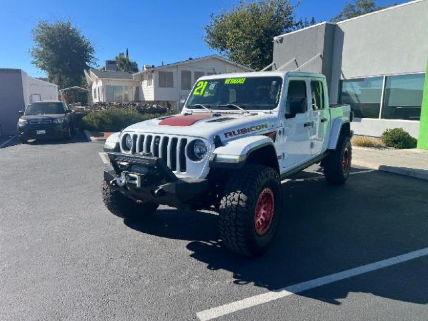 2021 Bright White Clearcoat /Red Jeep Gladiator Rubicon 4X4 (1C6JJTBG1ML) with an 3.6L V-6 DOHC engine, AUTOMATIC transmission, located at 1865 East Red Hills Pkwy, St. George, 84770, (435) 628-0023, 37.120850, -113.543640 - Classy red and white Gladiator rubicon with lift and tires. Great condition and drives straight. Specs: GVWR: 6,250 lbs w/Max Tow Package LED LIGHTING GROUP - AD6 Includes Daytime Running Lamps LED Accents LED Park Turn Lamps Front LED Fog Lamps LED Premium Reflector Headlamps LED Taillamps SA - Photo#2