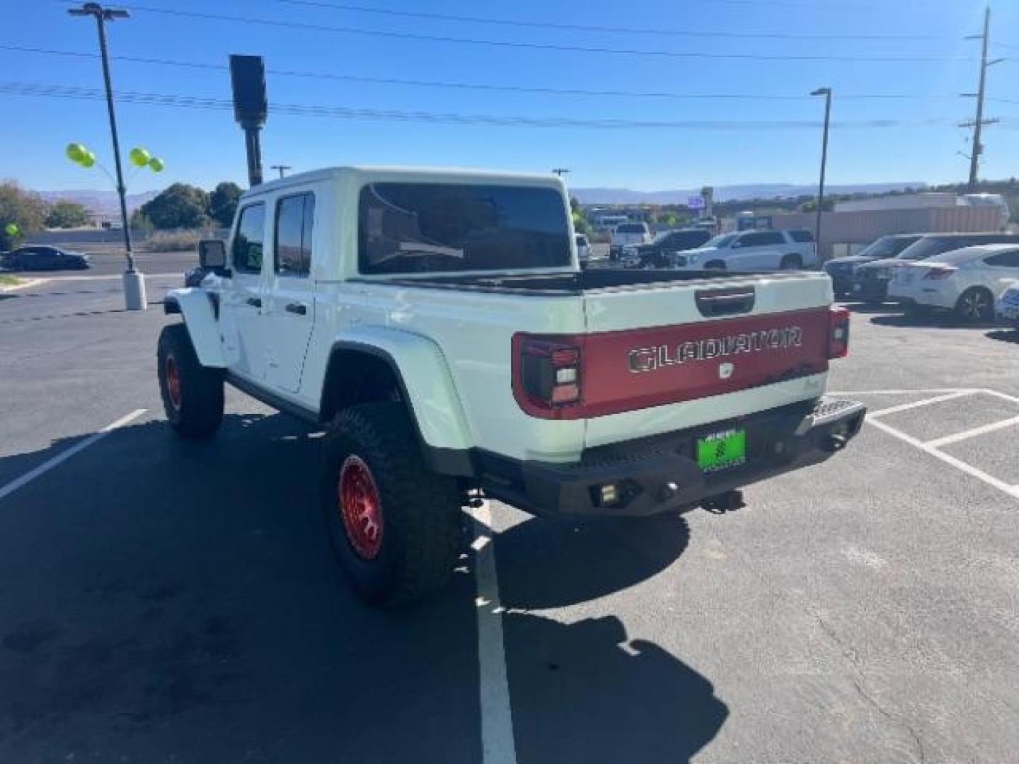 2021 Bright White Clearcoat /Red Jeep Gladiator Rubicon 4X4 (1C6JJTBG1ML) with an 3.6L V-6 DOHC engine, AUTOMATIC transmission, located at 1865 East Red Hills Pkwy, St. George, 84770, (435) 628-0023, 37.120850, -113.543640 - Classy red and white Gladiator rubicon with lift and tires. Great condition and drives straight. Specs: GVWR: 6,250 lbs w/Max Tow Package LED LIGHTING GROUP - AD6 Includes Daytime Running Lamps LED Accents LED Park Turn Lamps Front LED Fog Lamps LED Premium Reflector Headlamps LED Taillamps SA - Photo#4