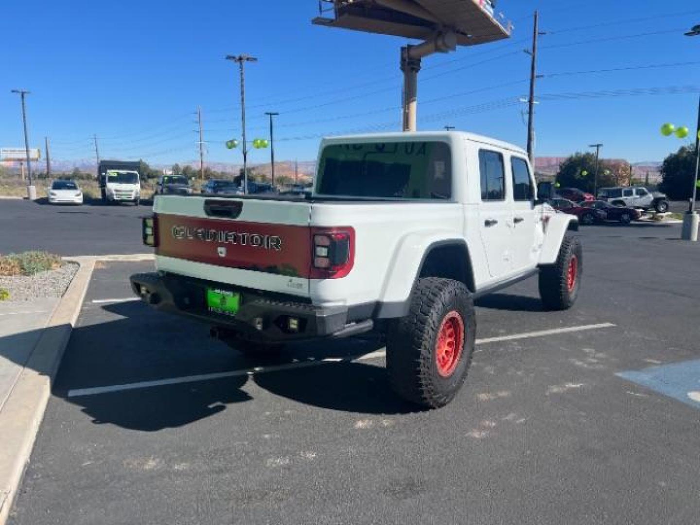 2021 Bright White Clearcoat /Red Jeep Gladiator Rubicon 4X4 (1C6JJTBG1ML) with an 3.6L V-6 DOHC engine, AUTOMATIC transmission, located at 1865 East Red Hills Pkwy, St. George, 84770, (435) 628-0023, 37.120850, -113.543640 - Classy red and white Gladiator rubicon with lift and tires. Great condition and drives straight. Specs: GVWR: 6,250 lbs w/Max Tow Package LED LIGHTING GROUP - AD6 Includes Daytime Running Lamps LED Accents LED Park Turn Lamps Front LED Fog Lamps LED Premium Reflector Headlamps LED Taillamps SA - Photo#6