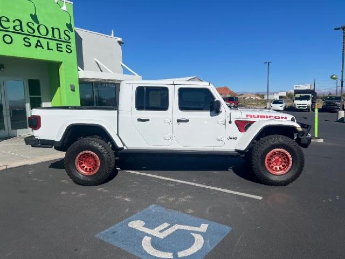 2021 Bright White Clearcoat /Red Jeep Gladiator Rubicon 4X4 (1C6JJTBG1ML) with an 3.6L V-6 DOHC engine, AUTOMATIC transmission, located at 1865 East Red Hills Pkwy, St. George, 84770, (435) 628-0023, 37.120850, -113.543640 - Classy red and white Gladiator rubicon with lift and tires. Great condition and drives straight. Specs: GVWR: 6,250 lbs w/Max Tow Package LED LIGHTING GROUP - AD6 Includes Daytime Running Lamps LED Accents LED Park Turn Lamps Front LED Fog Lamps LED Premium Reflector Headlamps LED Taillamps SA - Photo#7