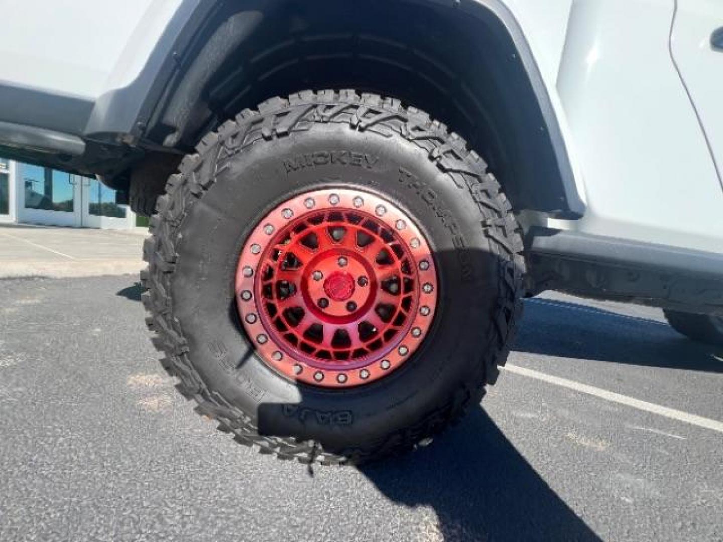 2021 Bright White Clearcoat /Red Jeep Gladiator Rubicon 4X4 (1C6JJTBG1ML) with an 3.6L V-6 DOHC engine, AUTOMATIC transmission, located at 1865 East Red Hills Pkwy, St. George, 84770, (435) 628-0023, 37.120850, -113.543640 - Classy red and white Gladiator rubicon with lift and tires. Great condition and drives straight. Specs: GVWR: 6,250 lbs w/Max Tow Package LED LIGHTING GROUP - AD6 Includes Daytime Running Lamps LED Accents LED Park Turn Lamps Front LED Fog Lamps LED Premium Reflector Headlamps LED Taillamps SA - Photo#9