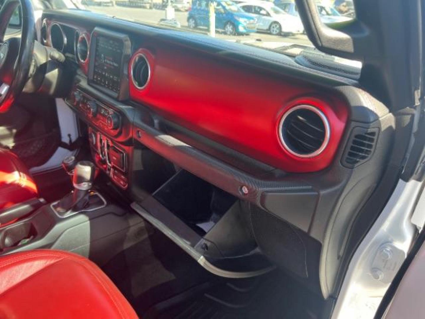 2021 Bright White Clearcoat /Red Jeep Gladiator Rubicon 4X4 (1C6JJTBG1ML) with an 3.6L V-6 DOHC engine, AUTOMATIC transmission, located at 1865 East Red Hills Pkwy, St. George, 84770, (435) 628-0023, 37.120850, -113.543640 - Classy red and white Gladiator rubicon with lift and tires. Great condition and drives straight. Specs: GVWR: 6,250 lbs w/Max Tow Package LED LIGHTING GROUP - AD6 Includes Daytime Running Lamps LED Accents LED Park Turn Lamps Front LED Fog Lamps LED Premium Reflector Headlamps LED Taillamps SA - Photo#31