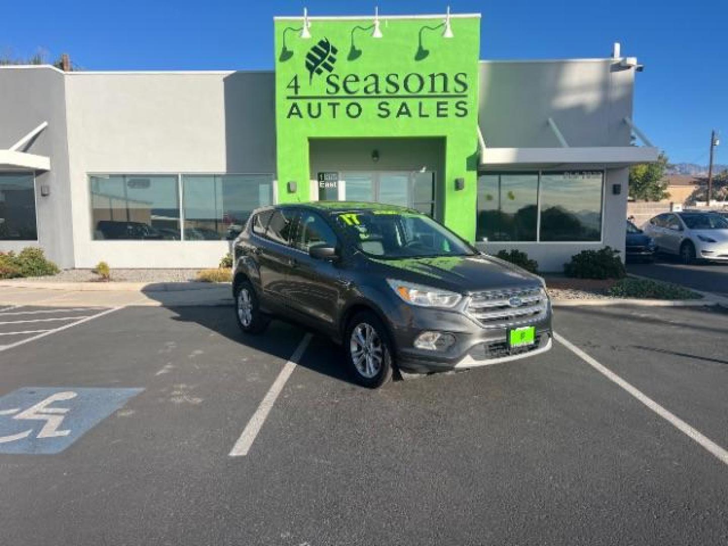 2017 Magnetic Metallic /Medium Light Stone Ford Escape SE (1FMCU9GD6HU) with an EcoBoost 1.5L I-4 gasoline direct injection engine, Automatic transmission, located at 1865 East Red Hills Pkwy, St. George, 84770, (435) 628-0023, 37.120850, -113.543640 - We specialize in helping ALL people get the best financing available. No matter your credit score, good, bad or none we can get you an amazing rate. Had a bankruptcy, divorce, or repossessions? We give you the green light to get your credit back on the road. Low down and affordable payments that fit - Photo#0