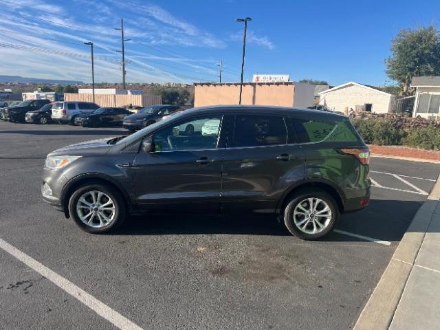 2017 Magnetic Metallic /Medium Light Stone Ford Escape SE (1FMCU9GD6HU) with an EcoBoost 1.5L I-4 gasoline direct injection engine, Automatic transmission, located at 1865 East Red Hills Pkwy, St. George, 84770, (435) 628-0023, 37.120850, -113.543640 - We specialize in helping ALL people get the best financing available. No matter your credit score, good, bad or none we can get you an amazing rate. Had a bankruptcy, divorce, or repossessions? We give you the green light to get your credit back on the road. Low down and affordable payments that fit - Photo#3