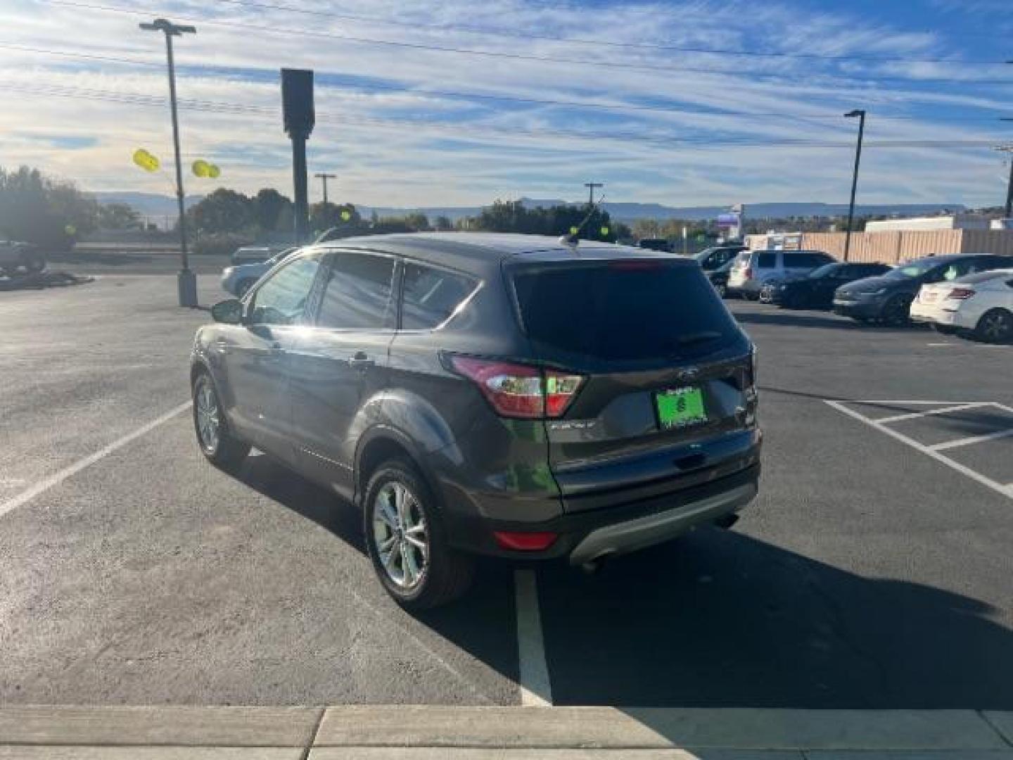 2017 Magnetic Metallic /Medium Light Stone Ford Escape SE (1FMCU9GD6HU) with an EcoBoost 1.5L I-4 gasoline direct injection engine, Automatic transmission, located at 1865 East Red Hills Pkwy, St. George, 84770, (435) 628-0023, 37.120850, -113.543640 - We specialize in helping ALL people get the best financing available. No matter your credit score, good, bad or none we can get you an amazing rate. Had a bankruptcy, divorce, or repossessions? We give you the green light to get your credit back on the road. Low down and affordable payments that fit - Photo#4