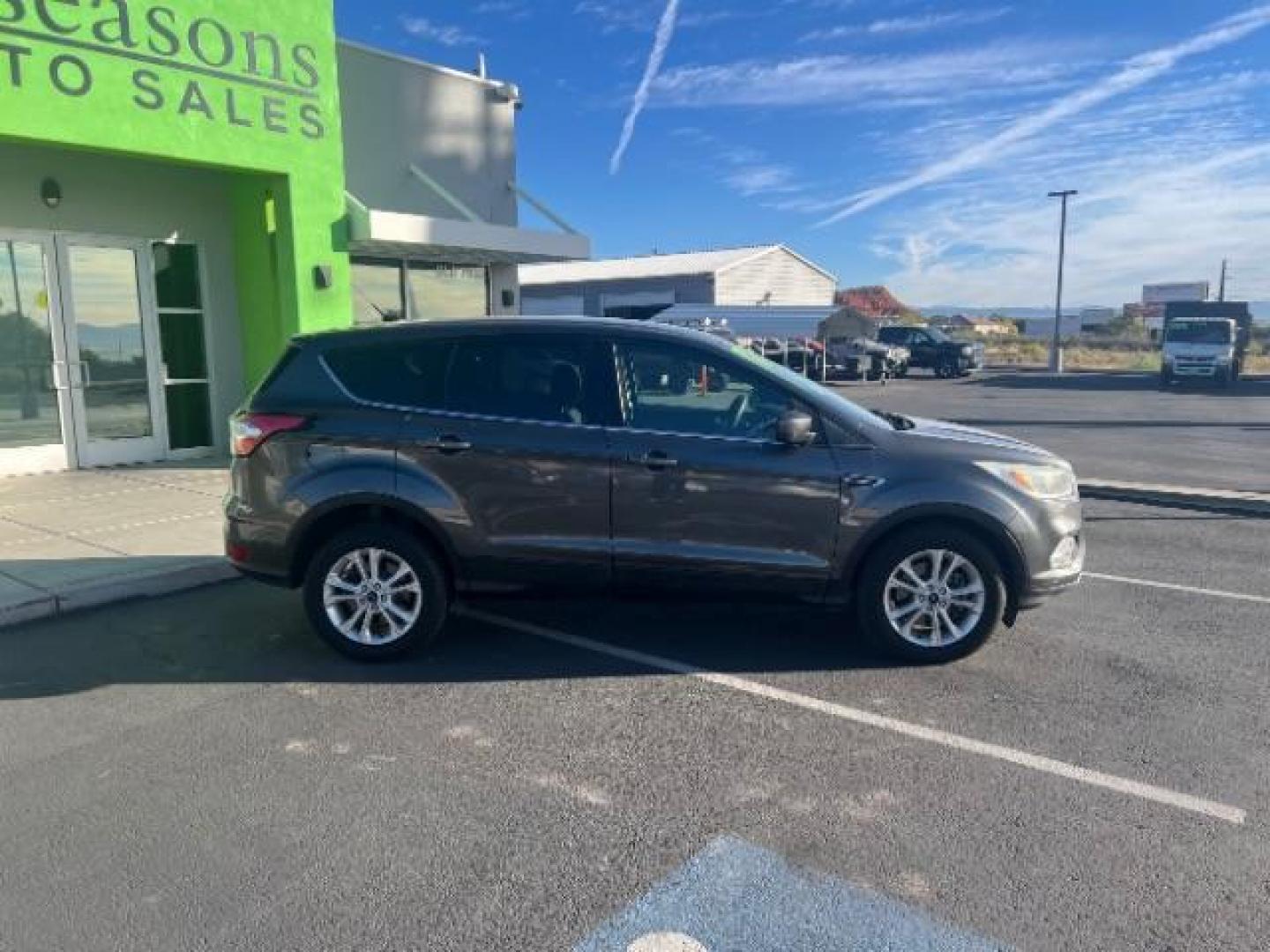 2017 Magnetic Metallic /Medium Light Stone Ford Escape SE (1FMCU9GD6HU) with an EcoBoost 1.5L I-4 gasoline direct injection engine, Automatic transmission, located at 1865 East Red Hills Pkwy, St. George, 84770, (435) 628-0023, 37.120850, -113.543640 - We specialize in helping ALL people get the best financing available. No matter your credit score, good, bad or none we can get you an amazing rate. Had a bankruptcy, divorce, or repossessions? We give you the green light to get your credit back on the road. Low down and affordable payments that fit - Photo#7