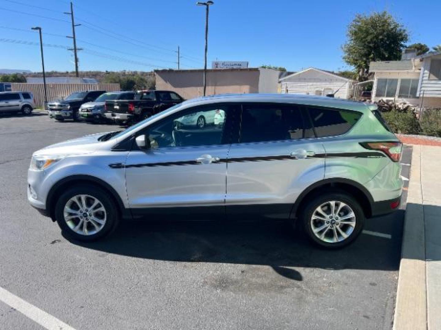 2017 Ingot Silver Metallic /Medium Light Stone Ford Escape SE (1FMCU9G96HU) with an EcoBoost 1.5L I-4 gasoline direct injection engine, Automatic transmission, located at 940 North Main Street, Cedar City, UT, 84720, (435) 628-0023, 37.692936, -113.061897 - Photo#3