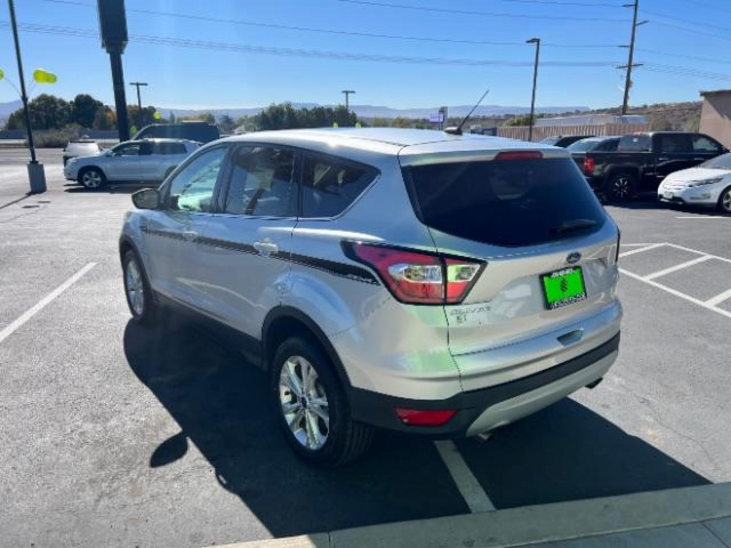 2017 Ingot Silver Metallic /Medium Light Stone Ford Escape SE (1FMCU9G96HU) with an EcoBoost 1.5L I-4 gasoline direct injection engine, Automatic transmission, located at 940 North Main Street, Cedar City, UT, 84720, (435) 628-0023, 37.692936, -113.061897 - Photo#4