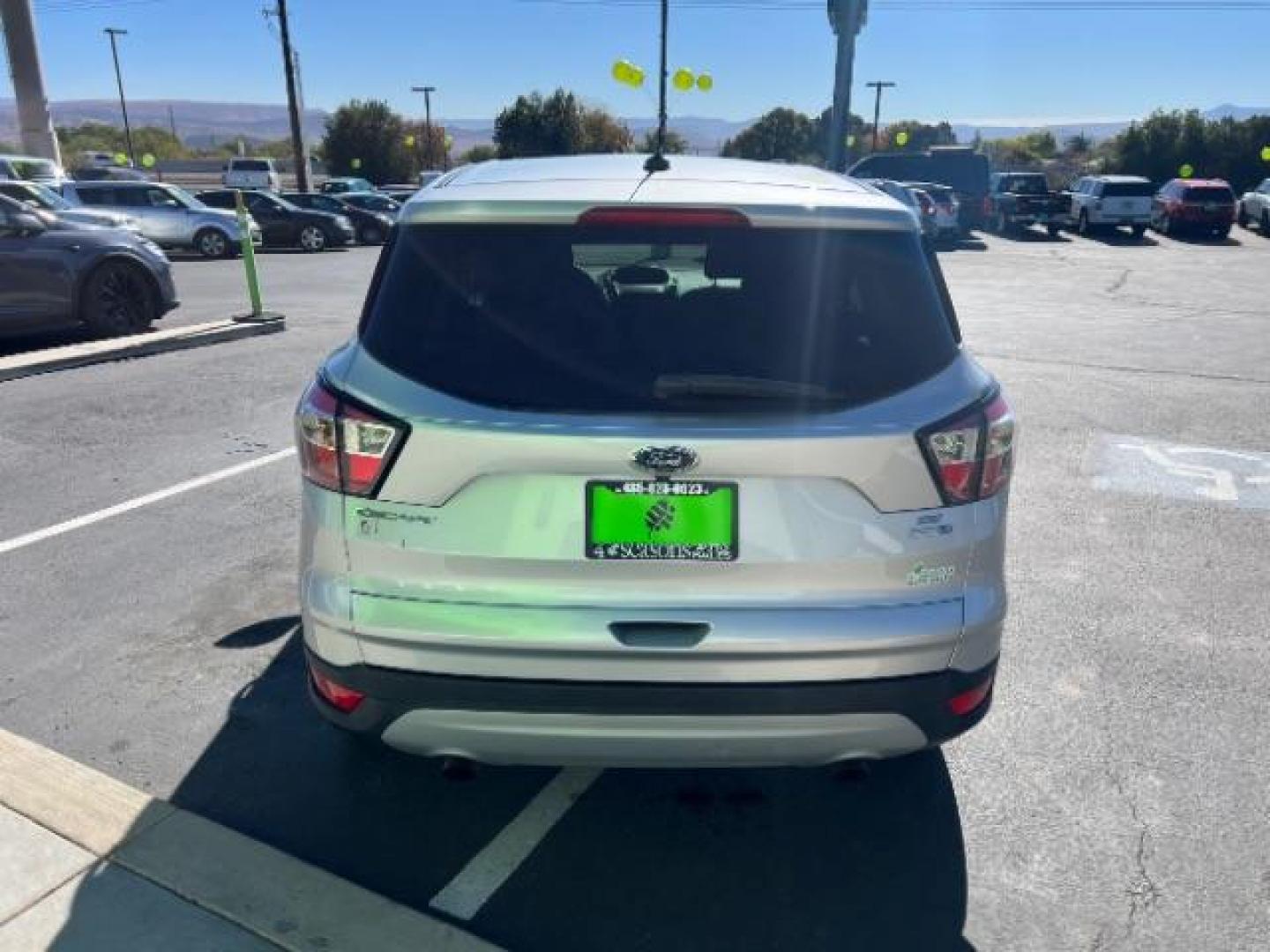 2017 Ingot Silver Metallic /Medium Light Stone Ford Escape SE (1FMCU9G96HU) with an EcoBoost 1.5L I-4 gasoline direct injection engine, Automatic transmission, located at 940 North Main Street, Cedar City, UT, 84720, (435) 628-0023, 37.692936, -113.061897 - Photo#5