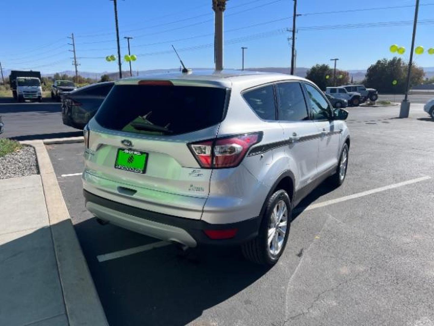 2017 Ingot Silver Metallic /Medium Light Stone Ford Escape SE (1FMCU9G96HU) with an EcoBoost 1.5L I-4 gasoline direct injection engine, Automatic transmission, located at 940 North Main Street, Cedar City, UT, 84720, (435) 628-0023, 37.692936, -113.061897 - Photo#6