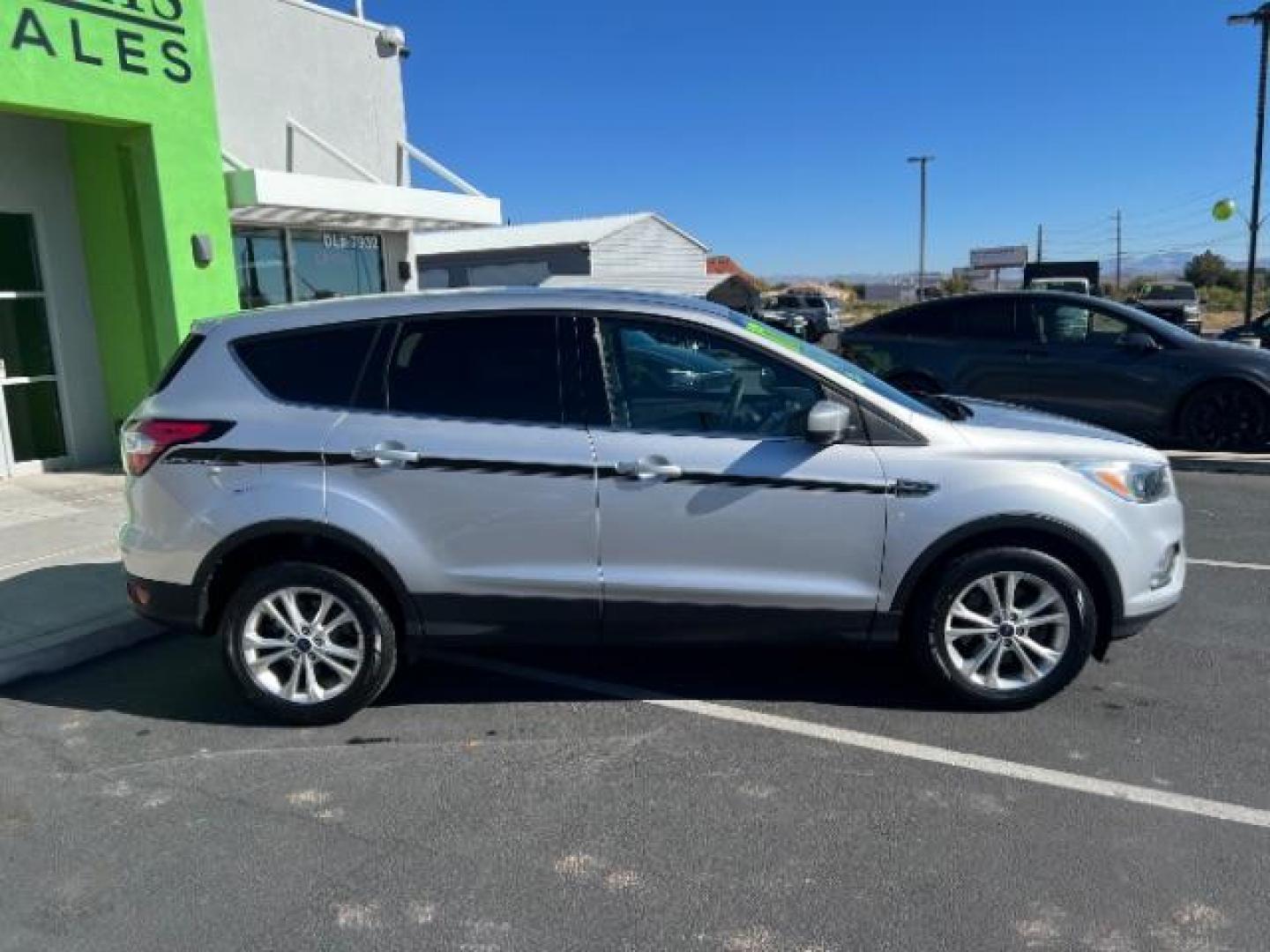 2017 Ingot Silver Metallic /Medium Light Stone Ford Escape SE (1FMCU9G96HU) with an EcoBoost 1.5L I-4 gasoline direct injection engine, Automatic transmission, located at 940 North Main Street, Cedar City, UT, 84720, (435) 628-0023, 37.692936, -113.061897 - Photo#7
