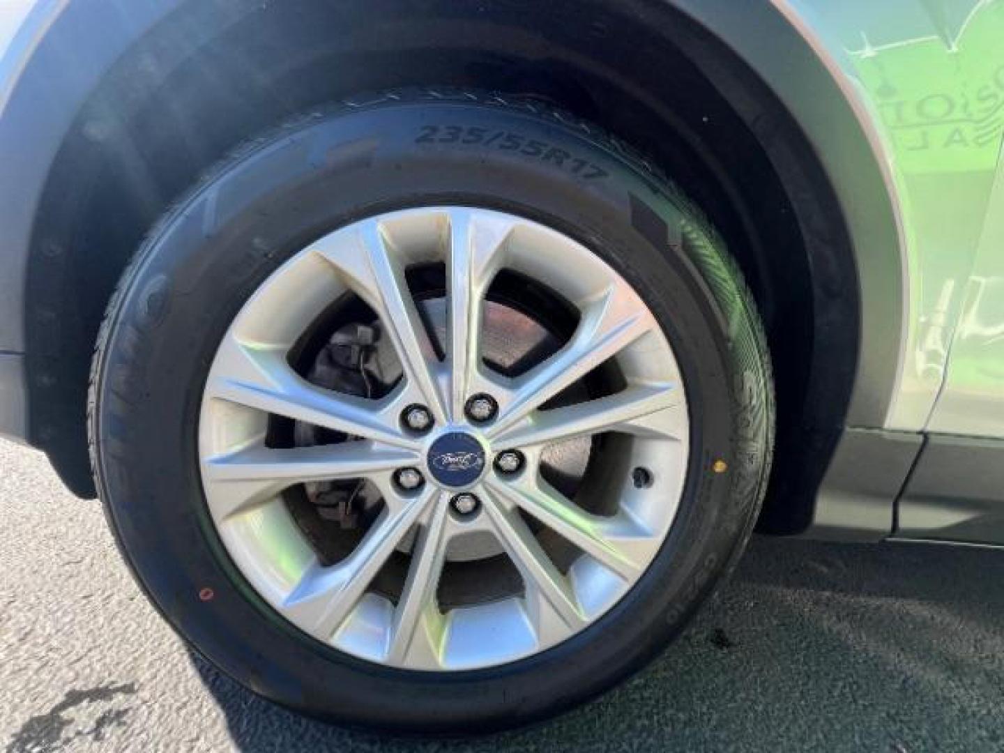 2017 Ingot Silver Metallic /Medium Light Stone Ford Escape SE (1FMCU9G96HU) with an EcoBoost 1.5L I-4 gasoline direct injection engine, Automatic transmission, located at 940 North Main Street, Cedar City, UT, 84720, (435) 628-0023, 37.692936, -113.061897 - Photo#9